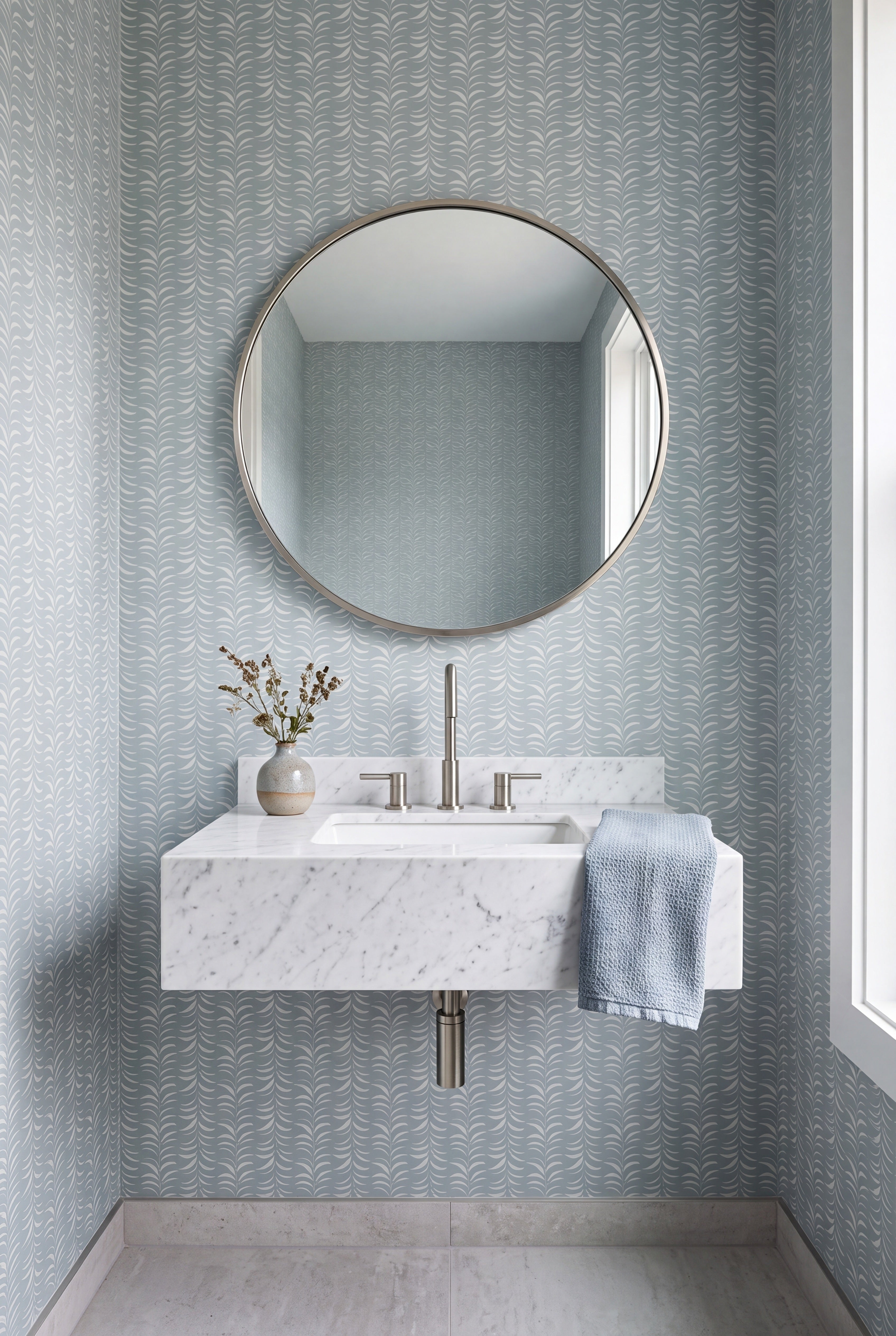 Slim sage-green leaf stripes on a light wallpaper in a powder room.