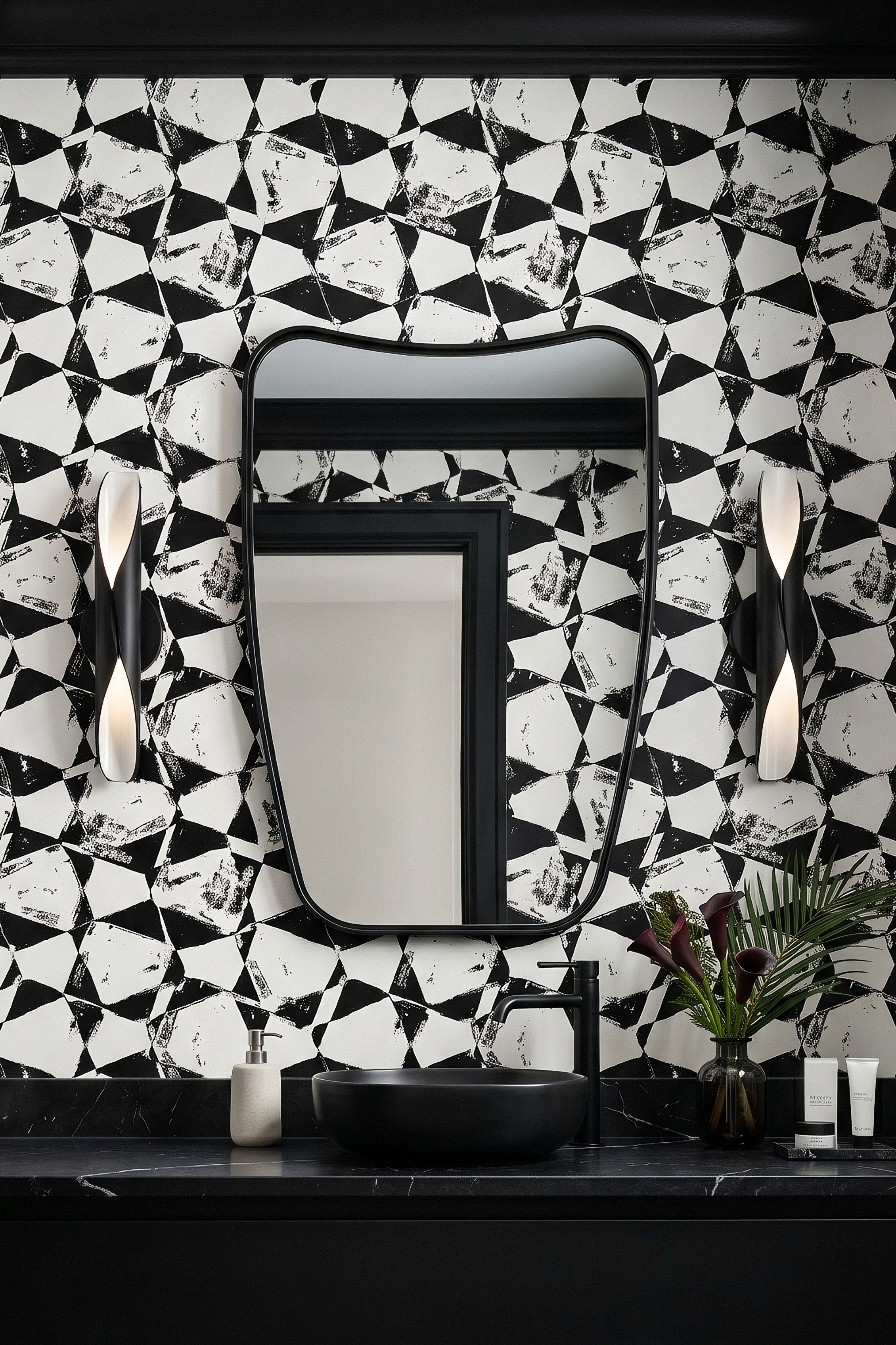 Black brushstroke diamonds on white wallpaper in a powder room.