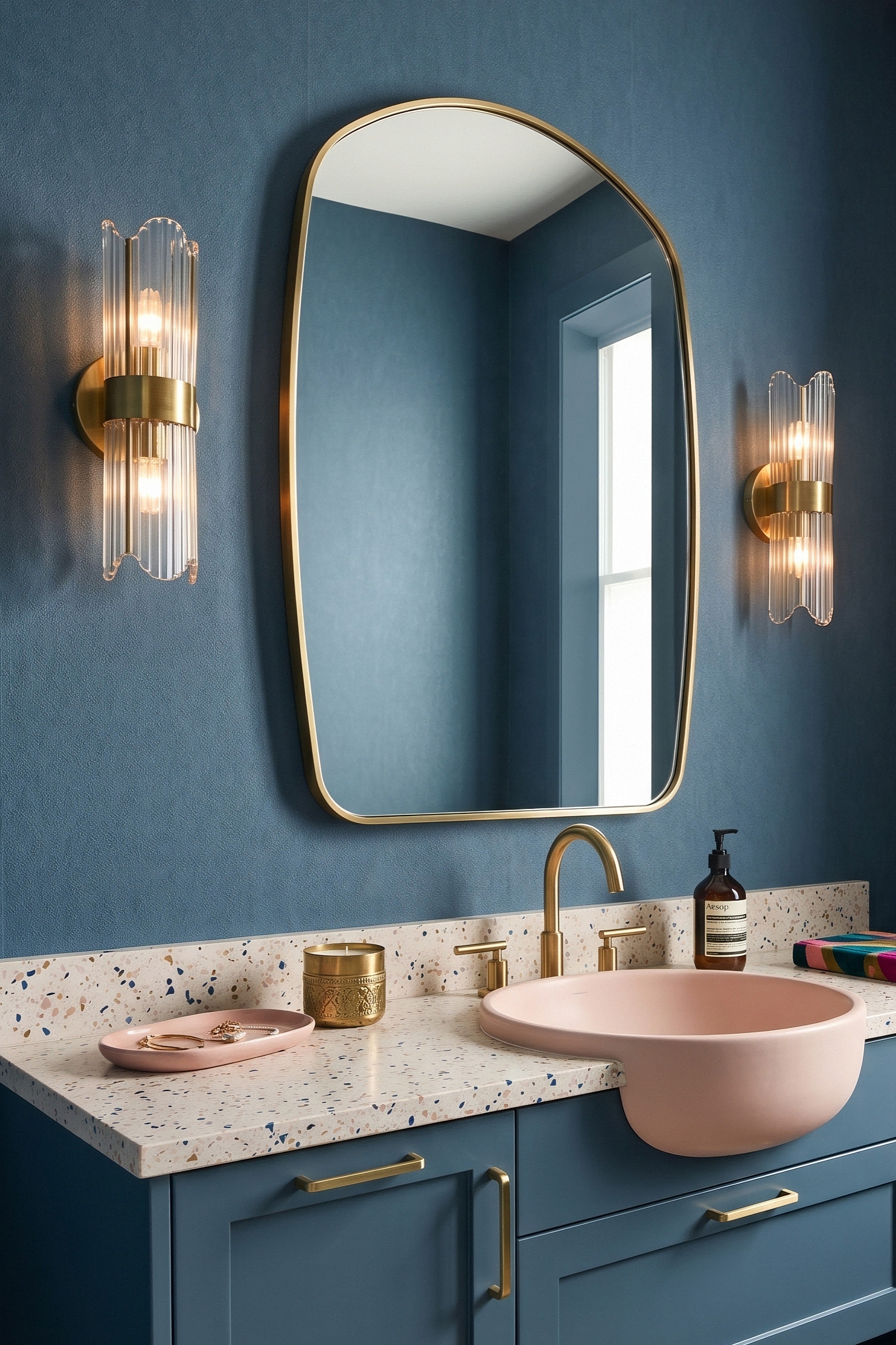 Deep navy mottled limewash plaster wallpaper in a powder room.