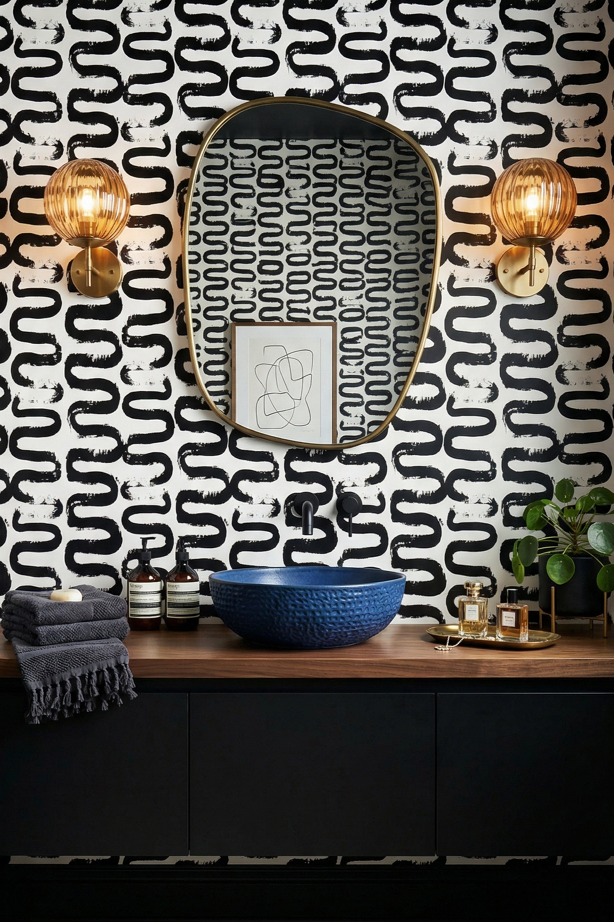 Hand-painted black waves on white minimalist wallpaper in a powder room.