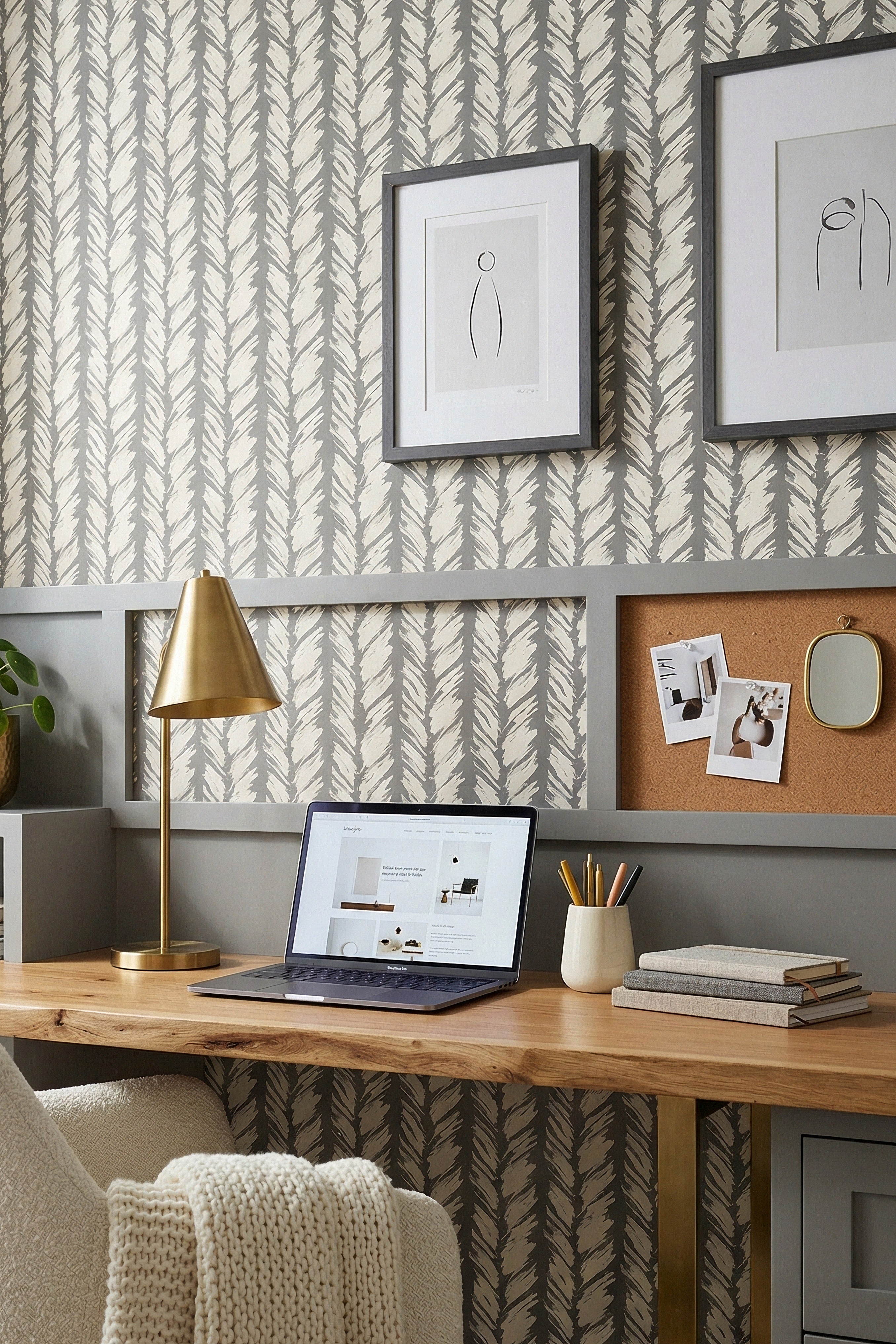Off-white brushstrokes on a warm gray striped wallpaper in a home office.