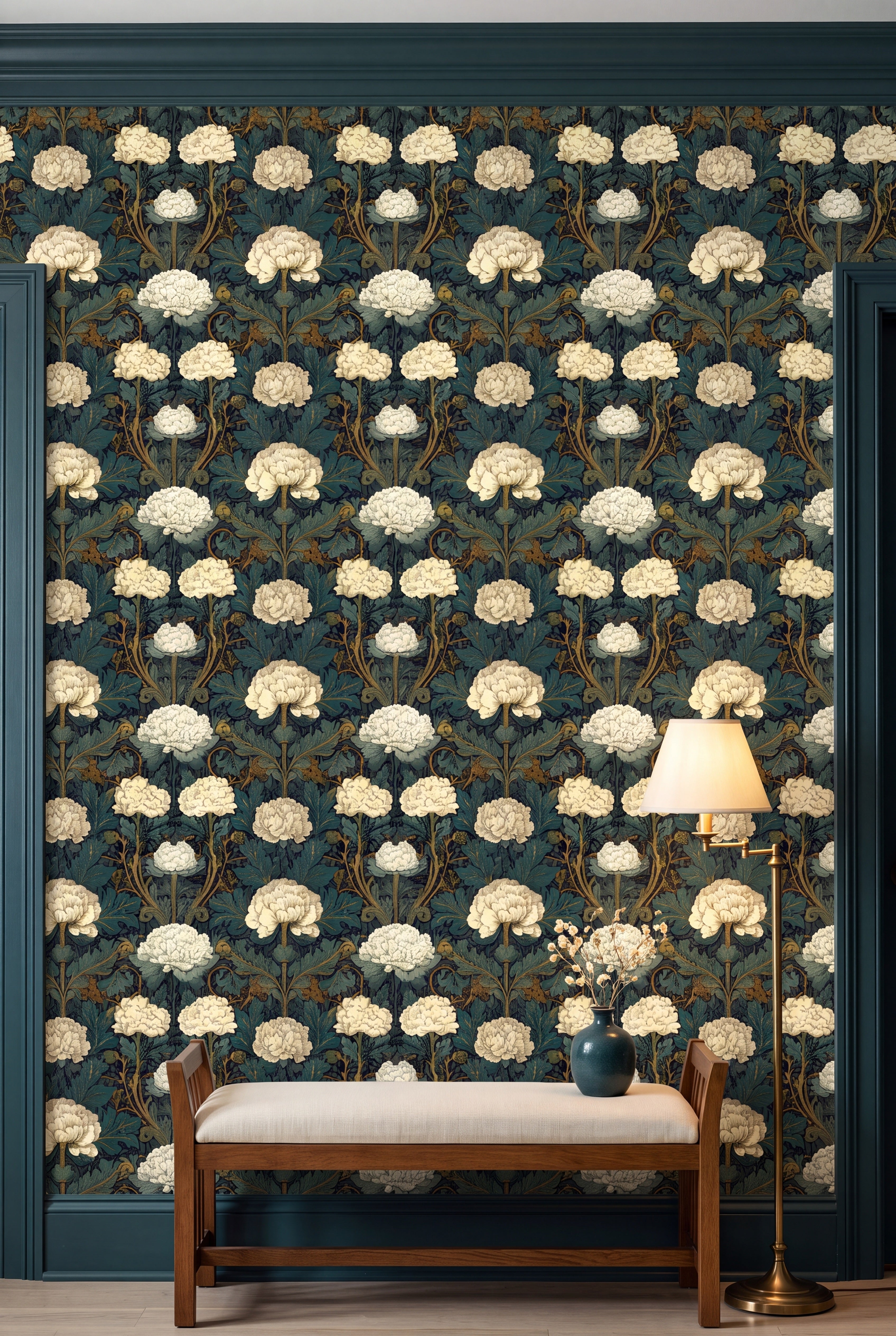 Ivory chrysanthemums over deep teal foliage wallpaper on an accent wall.