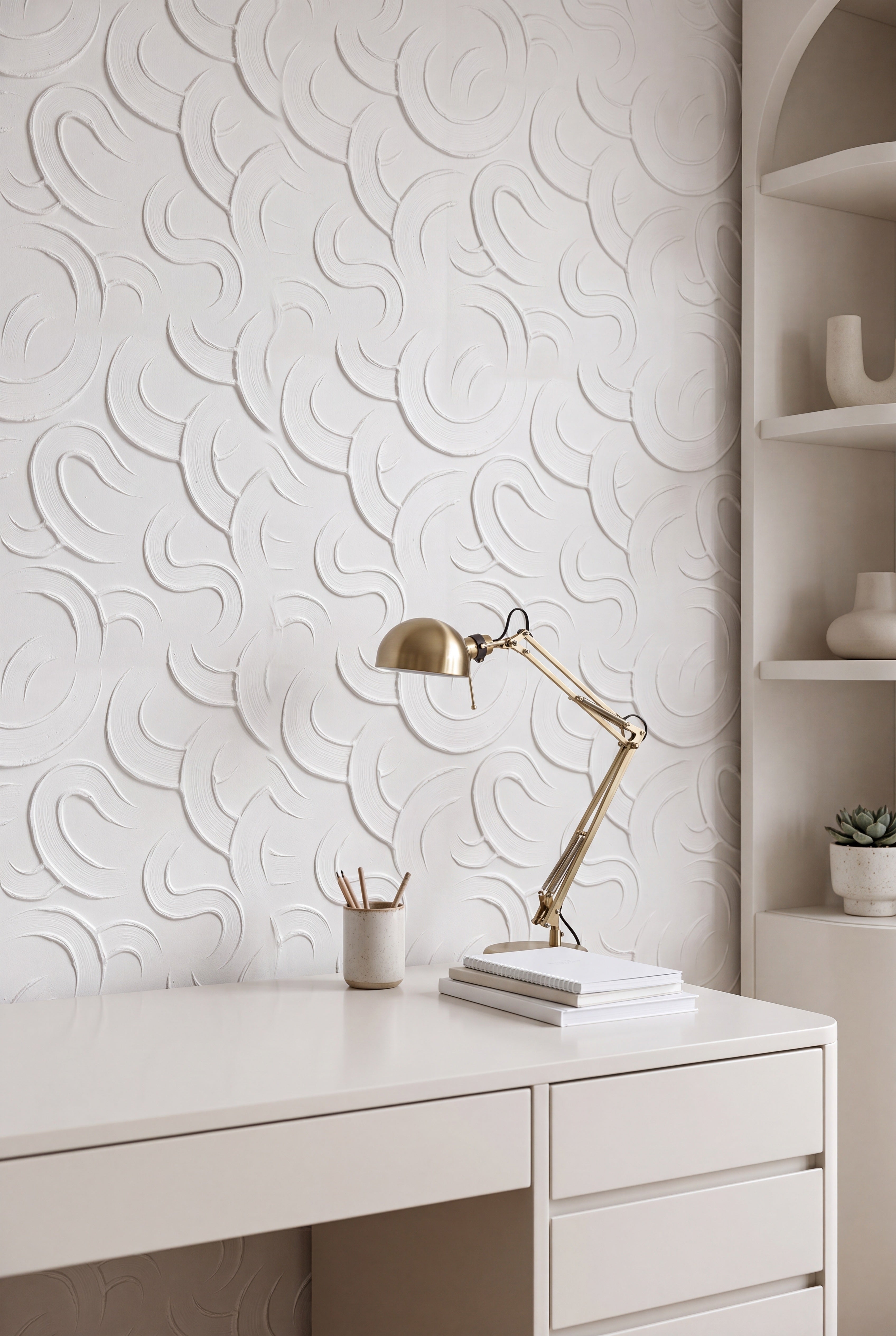 White brushstroke curves on a soft white tonal wallpaper in a home office.