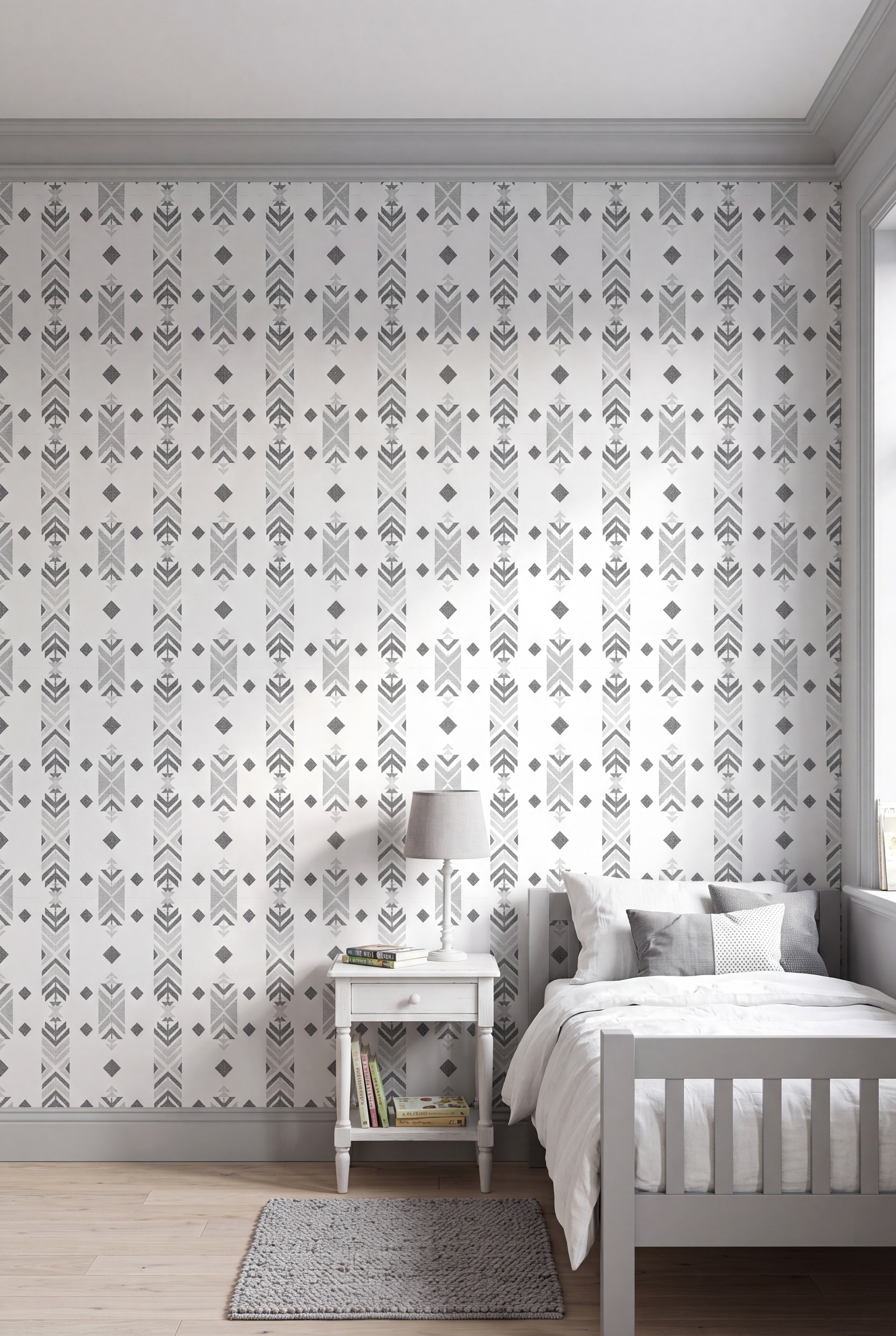 Grey and charcoal Southwest geometric motifs on white wallpaper in a kids' room.