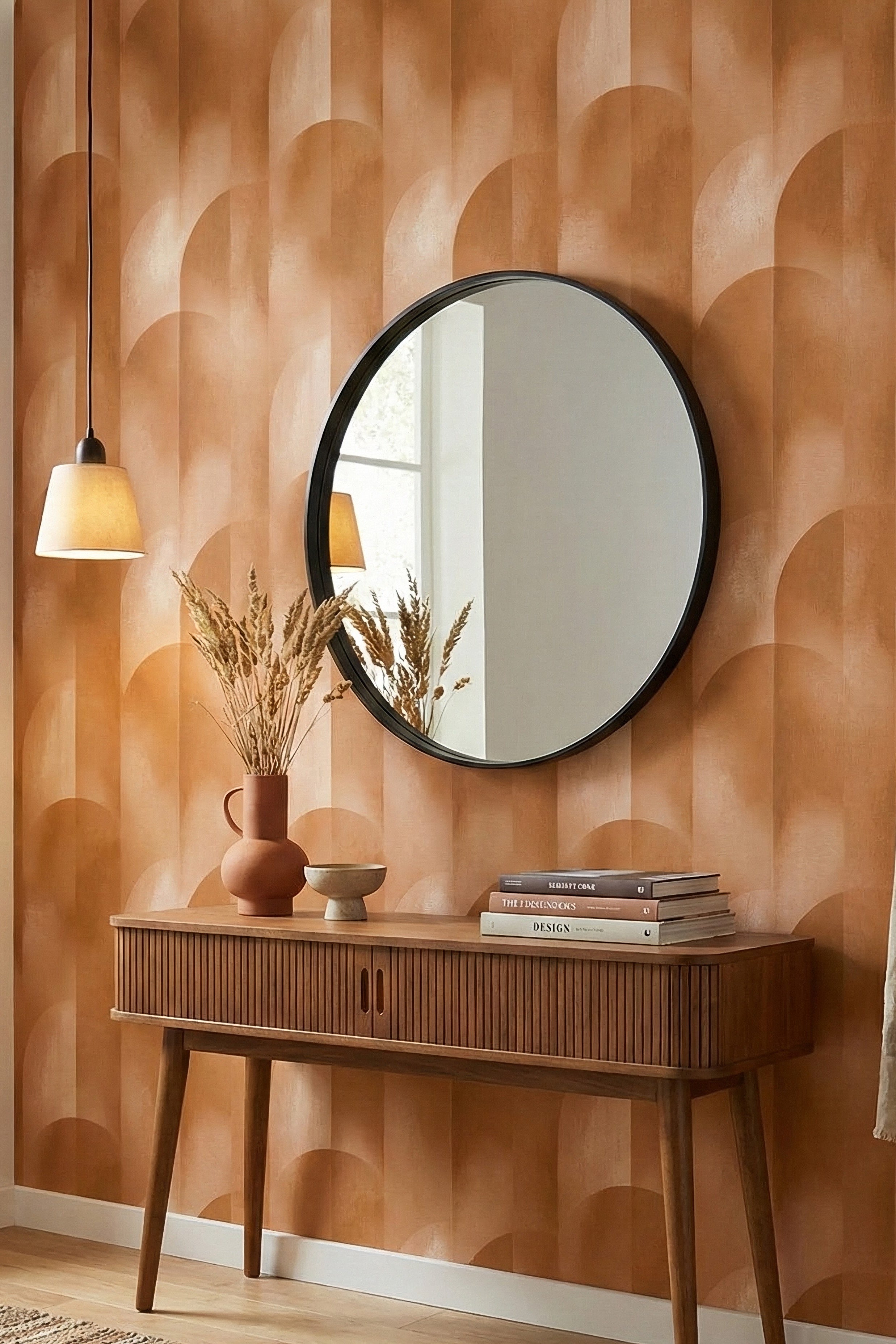 Warm terracotta arches on a bold geometric wallpaper in an entryway.