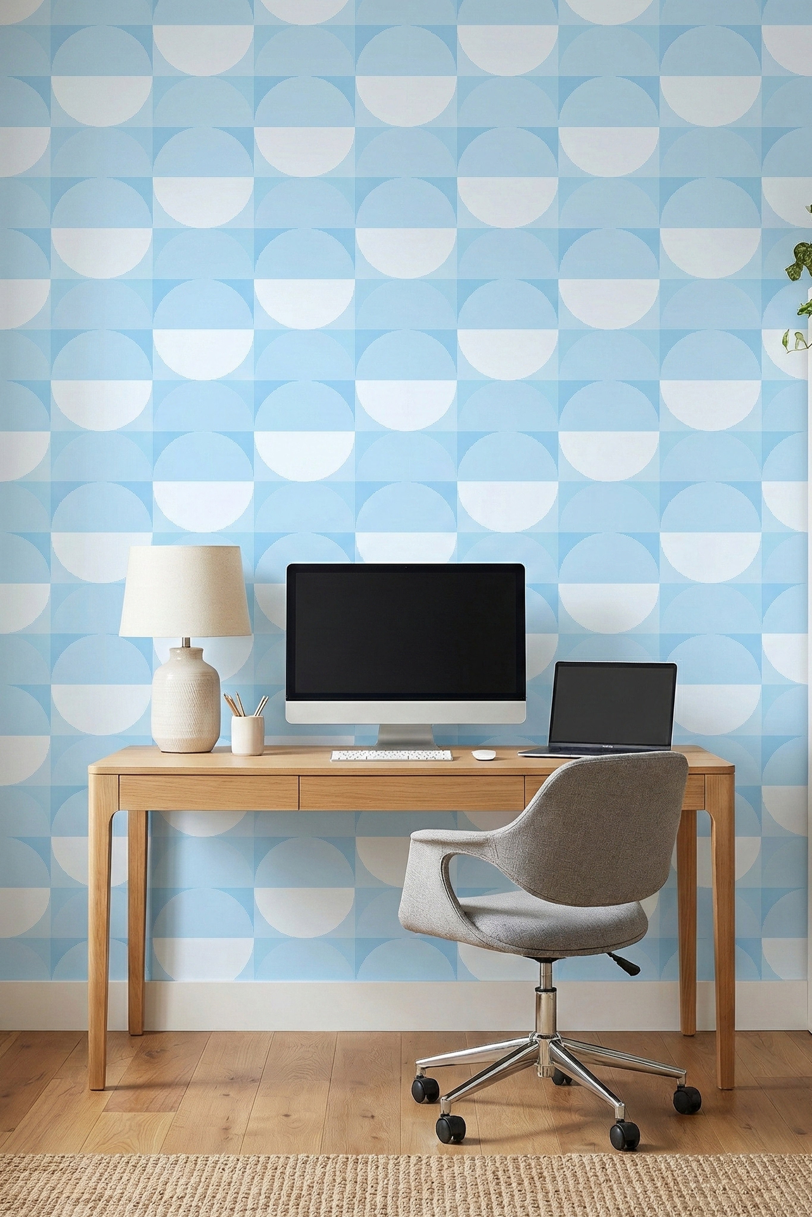 Overlapping soft blue circles in a retro geometric wallpaper in a home office.