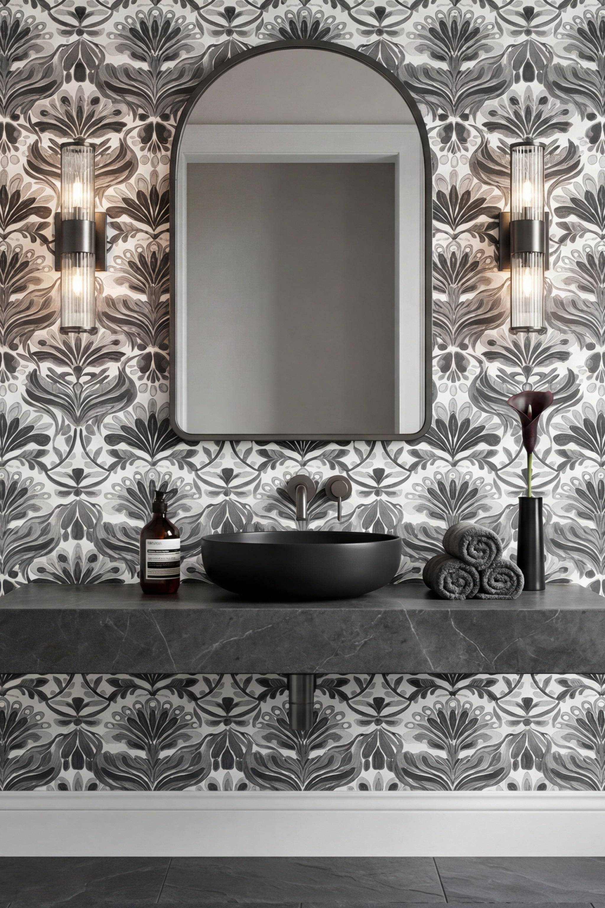 Black-and-white Art Nouveau birds and botanicals on powder room wallpaper.