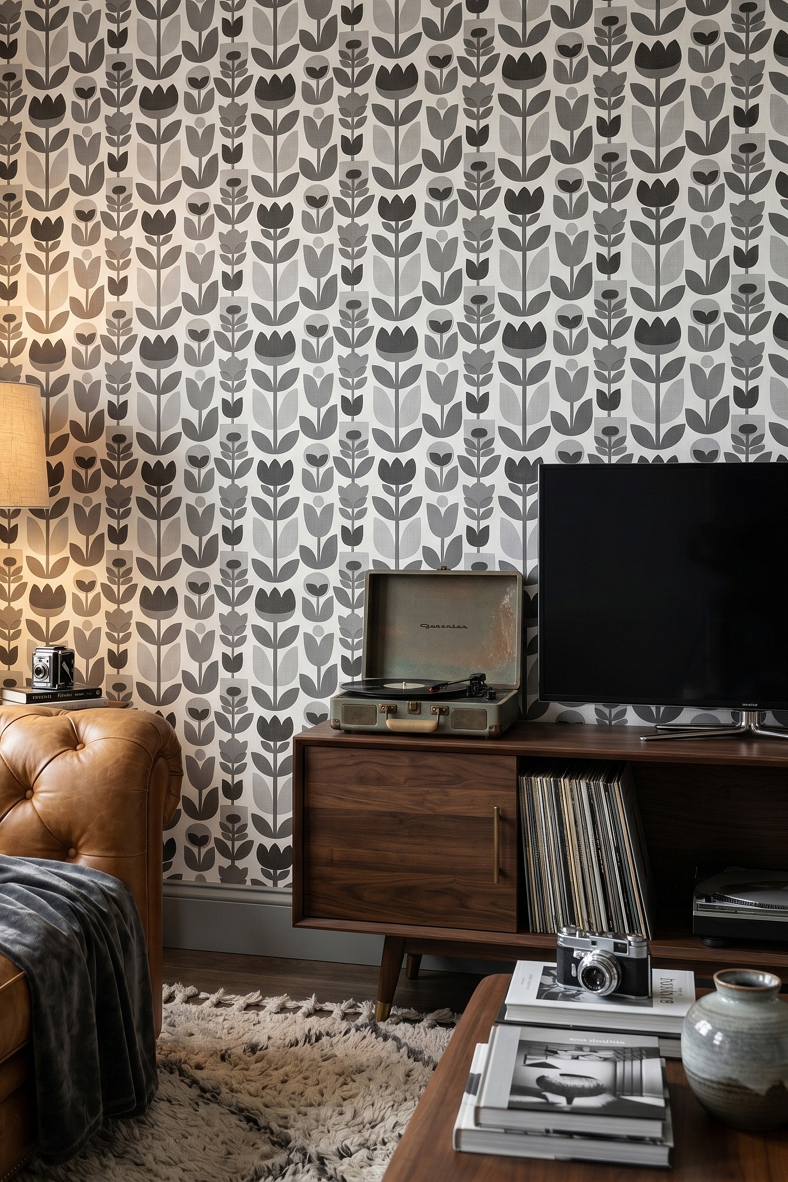 Black and white stylized tulip wallpaper in a media room.