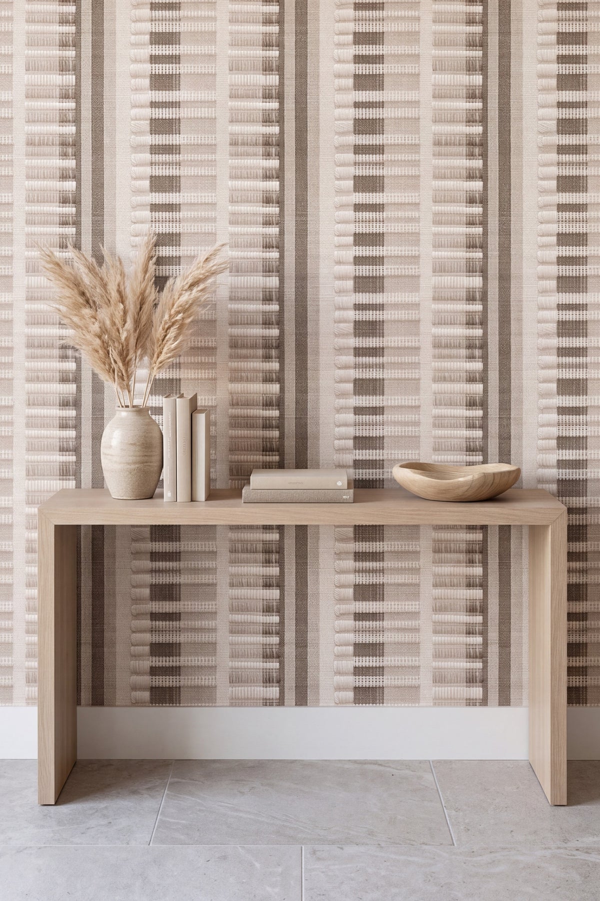 Cream and tan woven stripe wallpaper on a full accent wall.