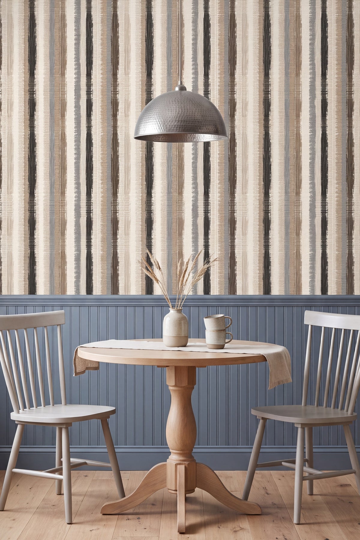 Charcoal and tan woven stripe wallpaper in a kitchen with painted cabinetry.