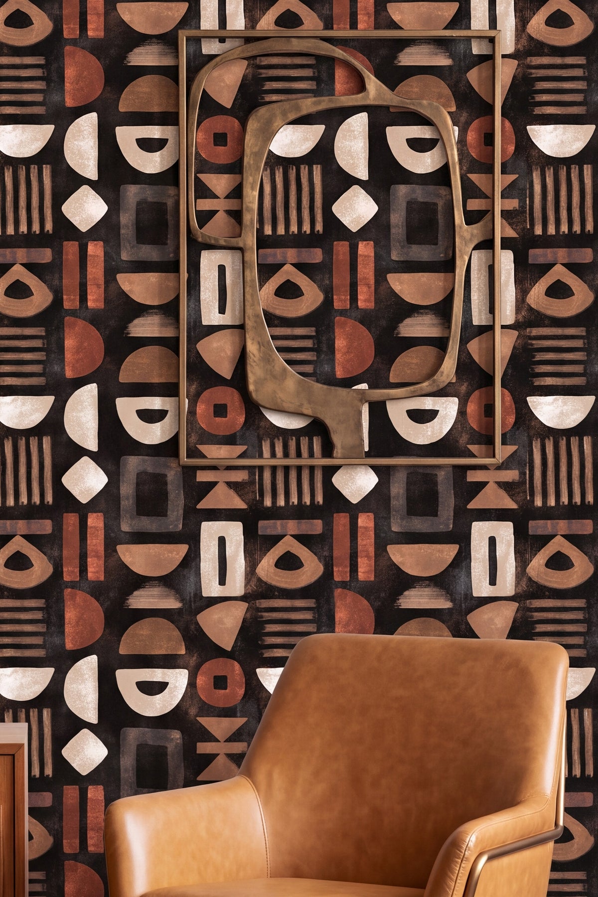 Tan and rust glyph shapes scattered on dark brown wallpaper in a living room.