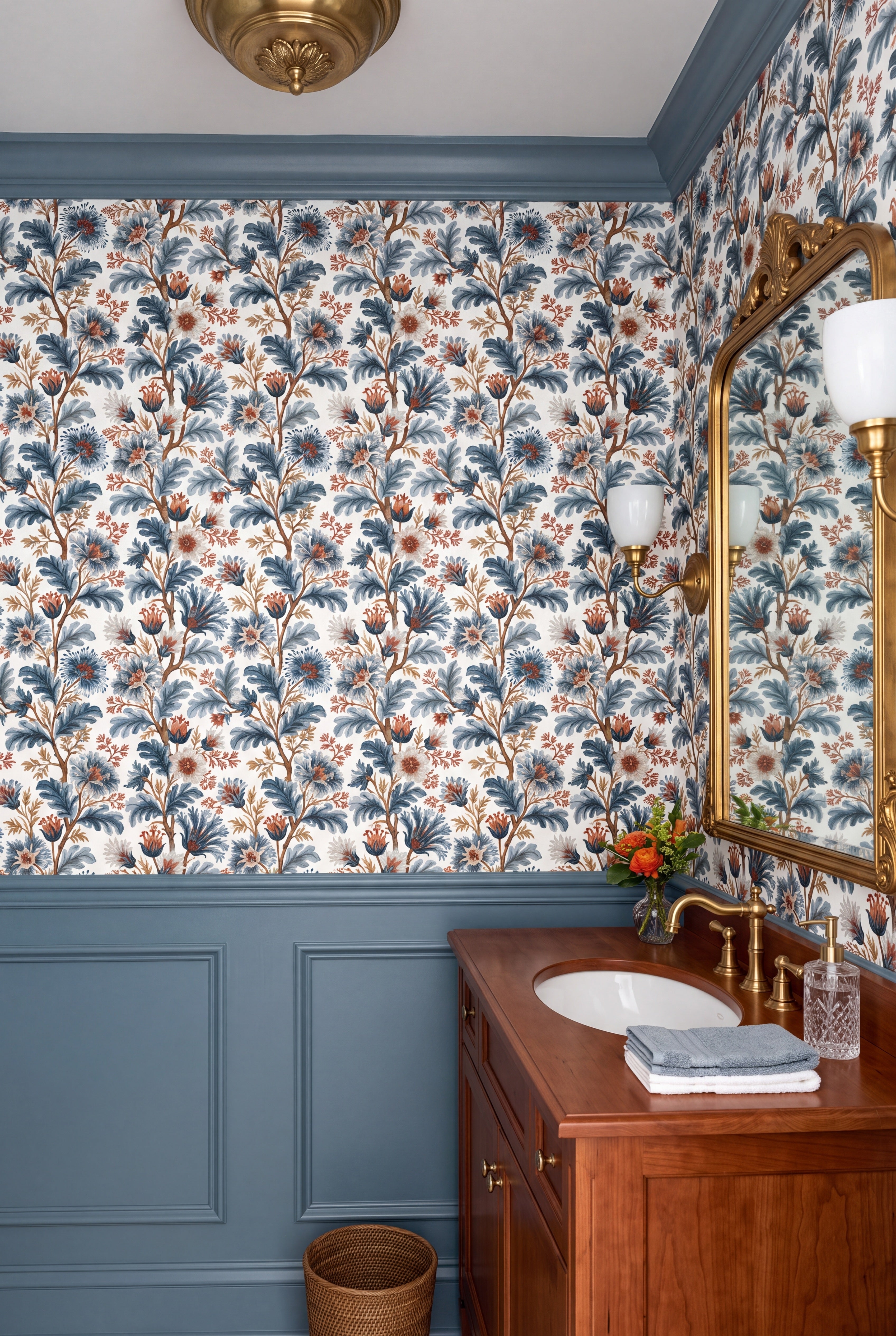 Blue grey florals climbing slender branches on white wallpaper in a powder room.