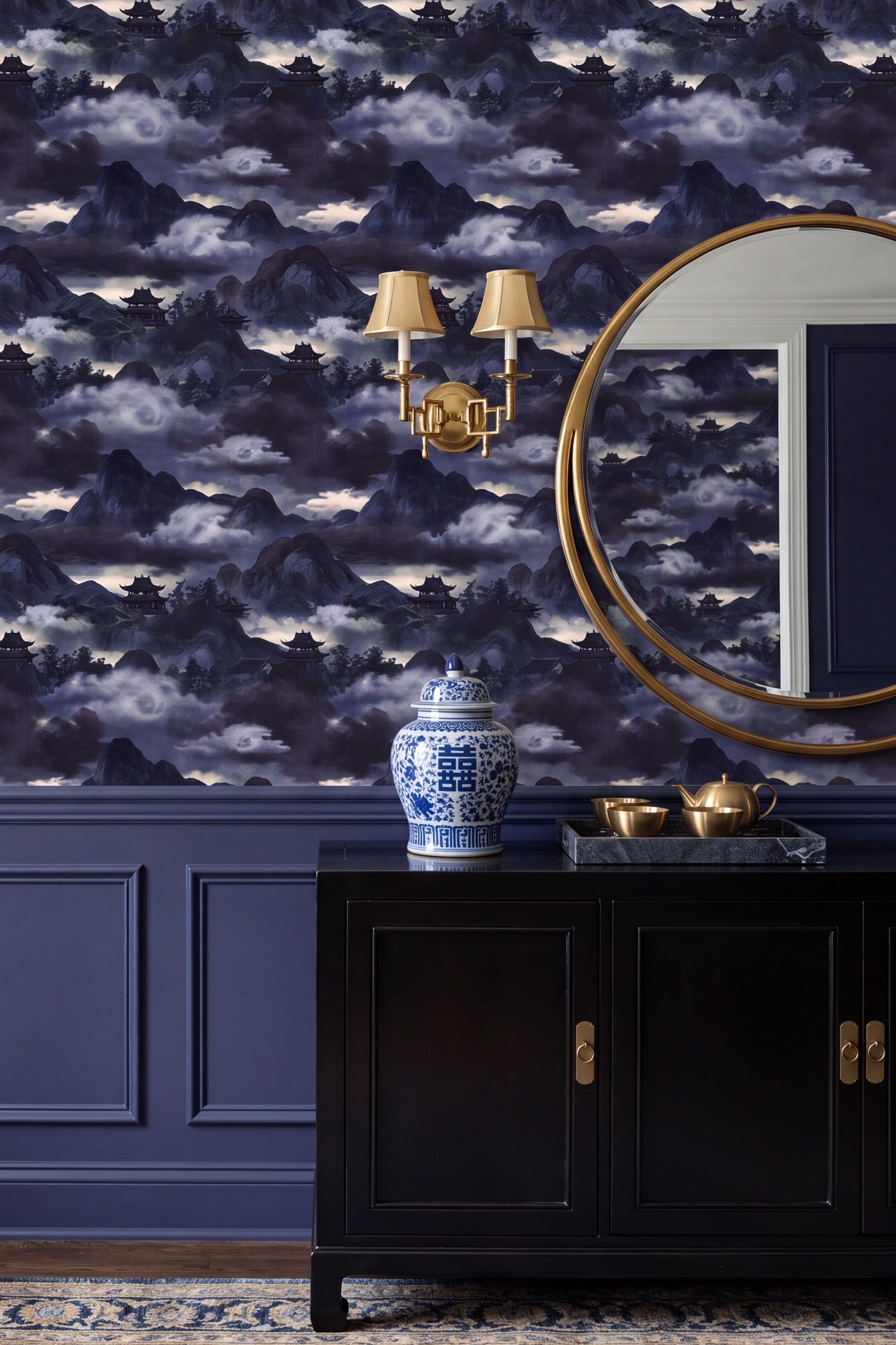 Indigo chinoiserie mountain and pagoda mural wallpaper in a dining room.