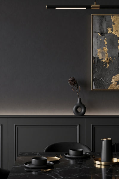 Deep charcoal-black limewash wallpaper in a dining room.