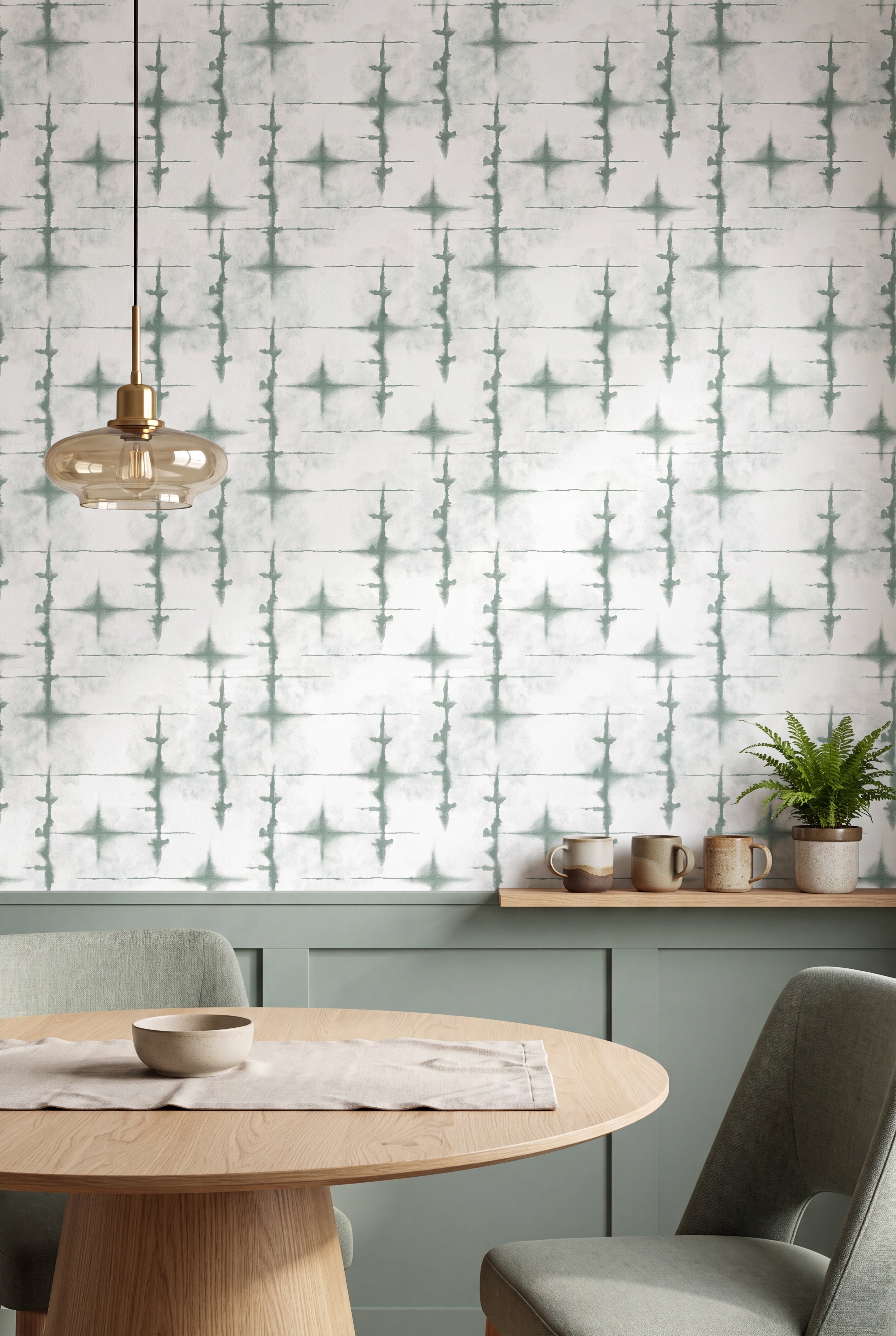 Sage green and white watercolor swirl wallpaper in a cozy nook.