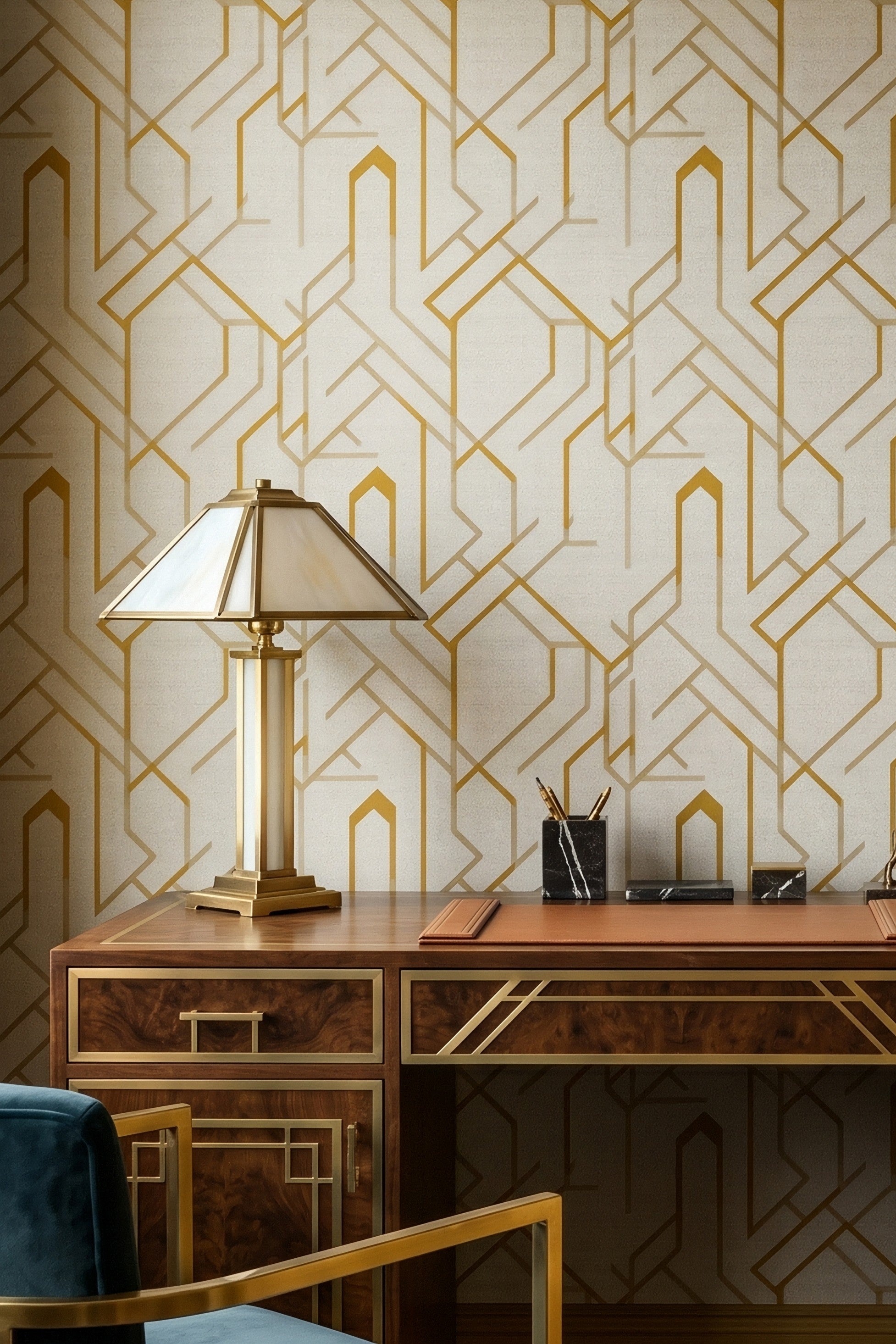 Gold Art Deco linework on soft linen wallpaper in a home office.