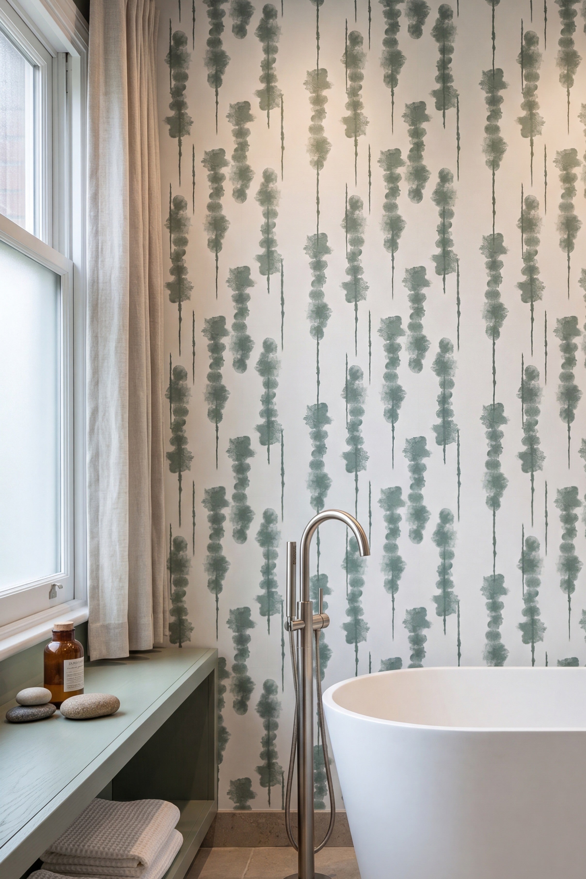 Sage green shibori-inspired dotted vertical stripe wallpaper on white in a bathroom.
