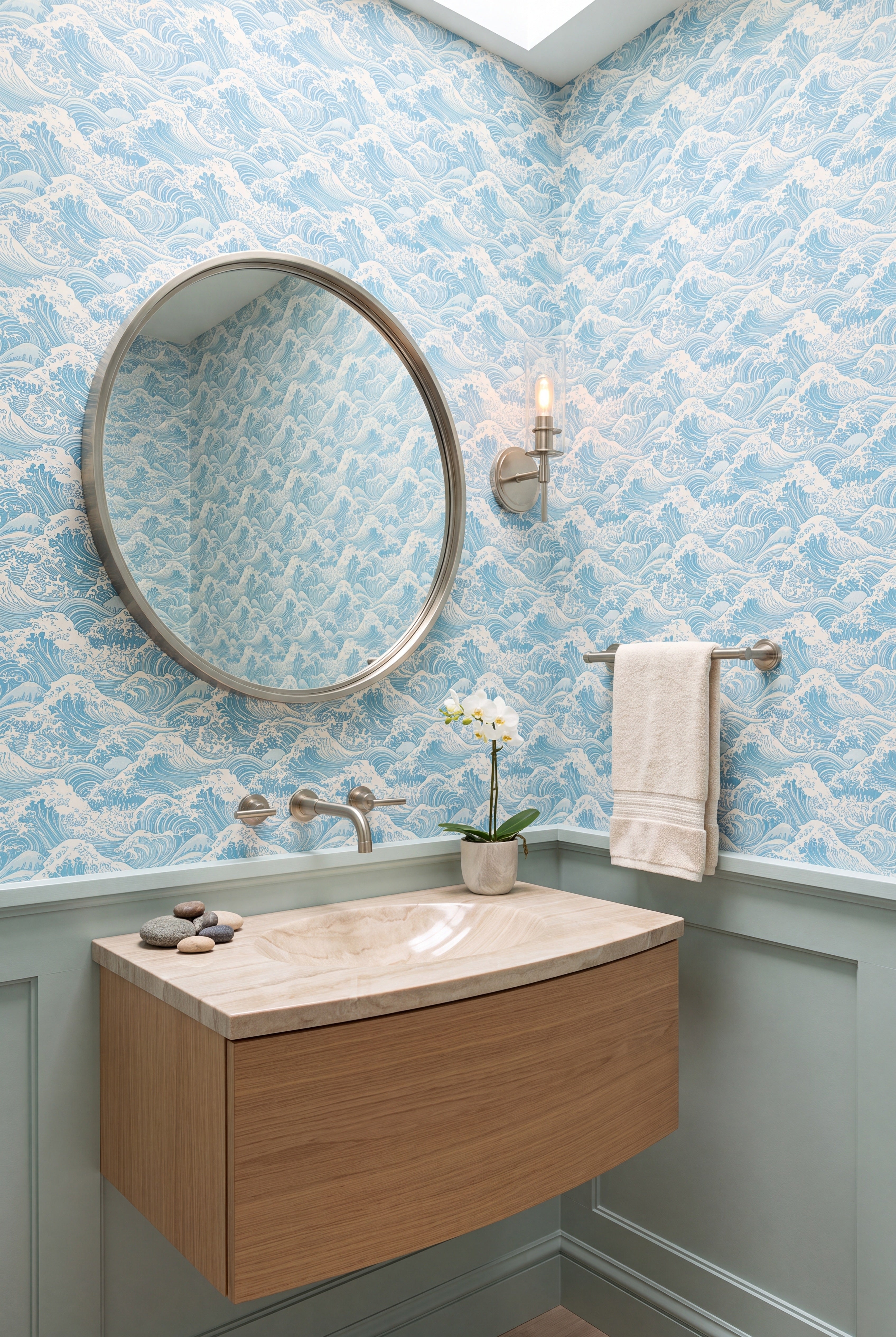 Layered ocean waves in graduated blues on wallpaper in a powder room.