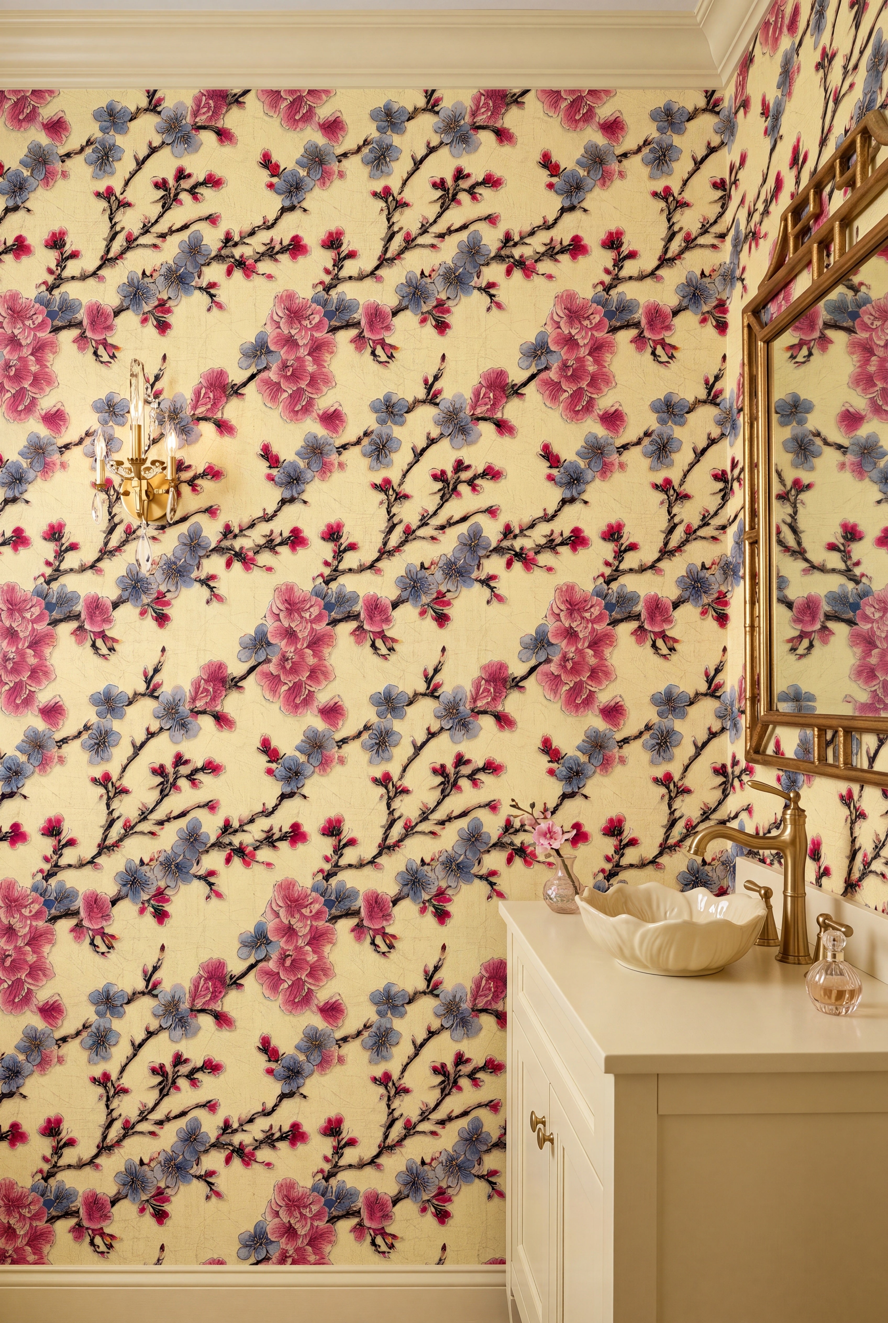 Pink and blue cherry blossoms on golden yellow wallpaper in a powder room.