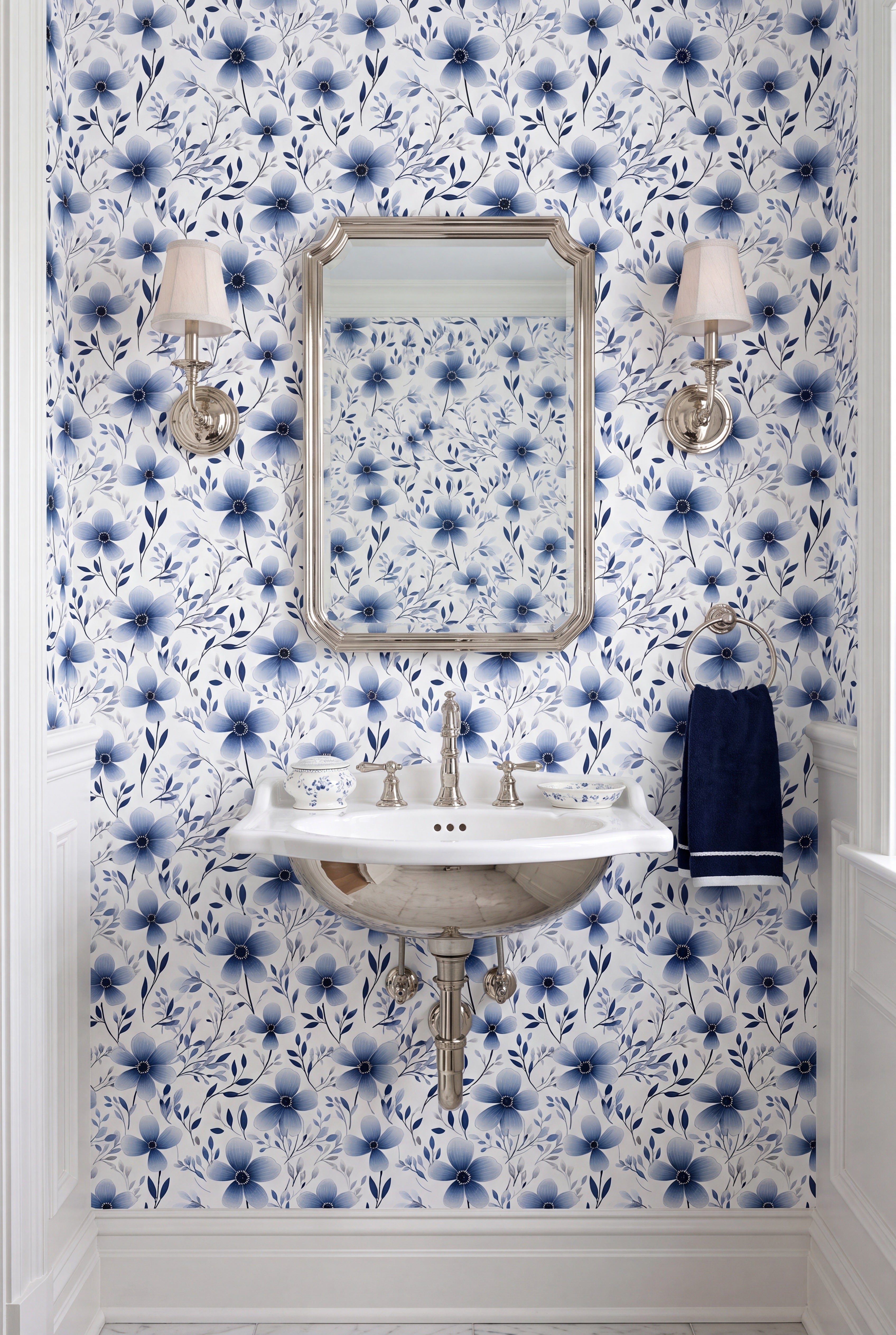 Small navy blooms on a crisp white floral wallpaper in a powder room.