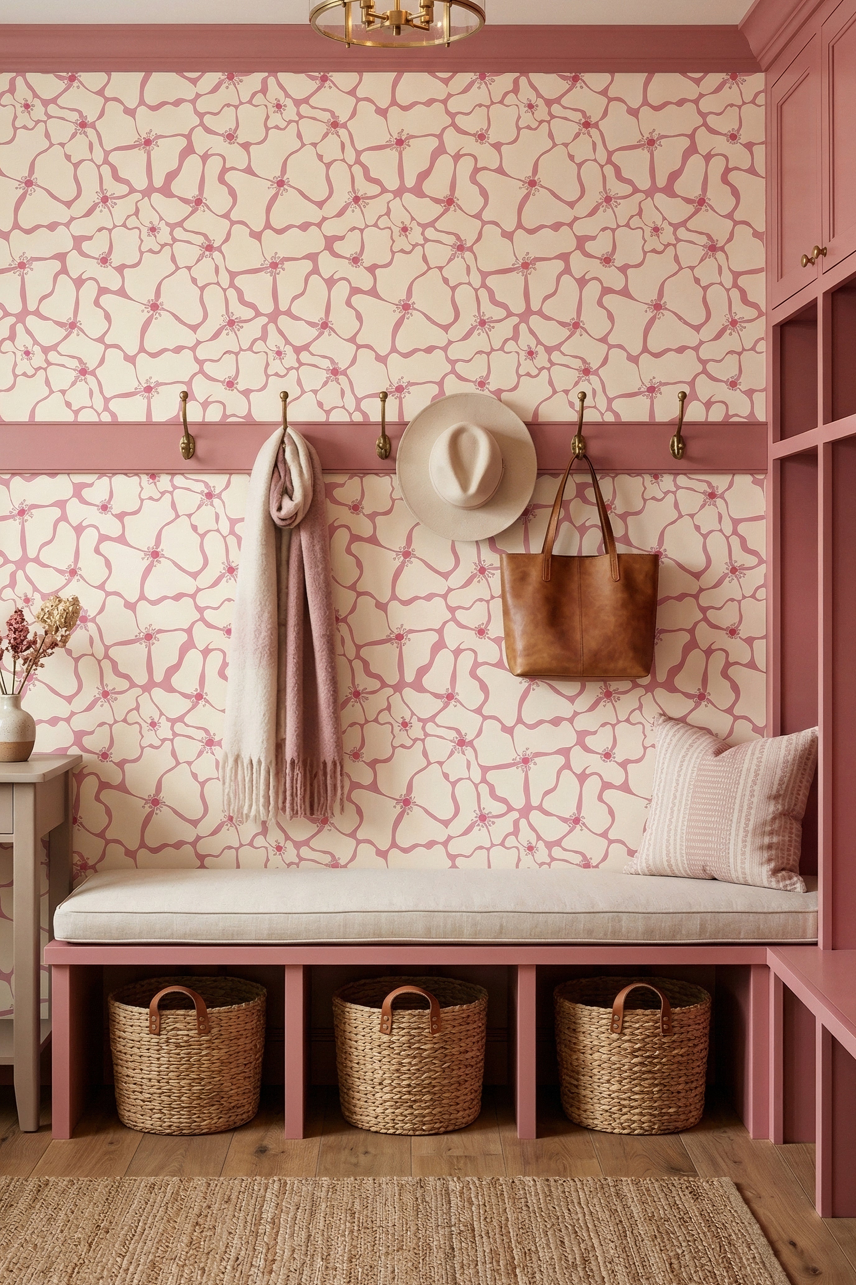 Oversized pink blossoms on a creamy floral wallpaper in a mudroom.