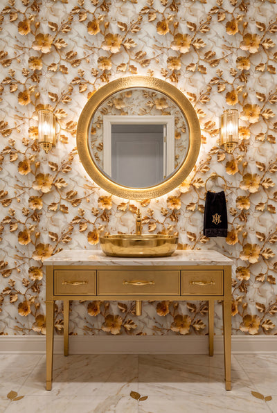 Gilded metallic florals on a pale marble wallpaper in a powder room.
