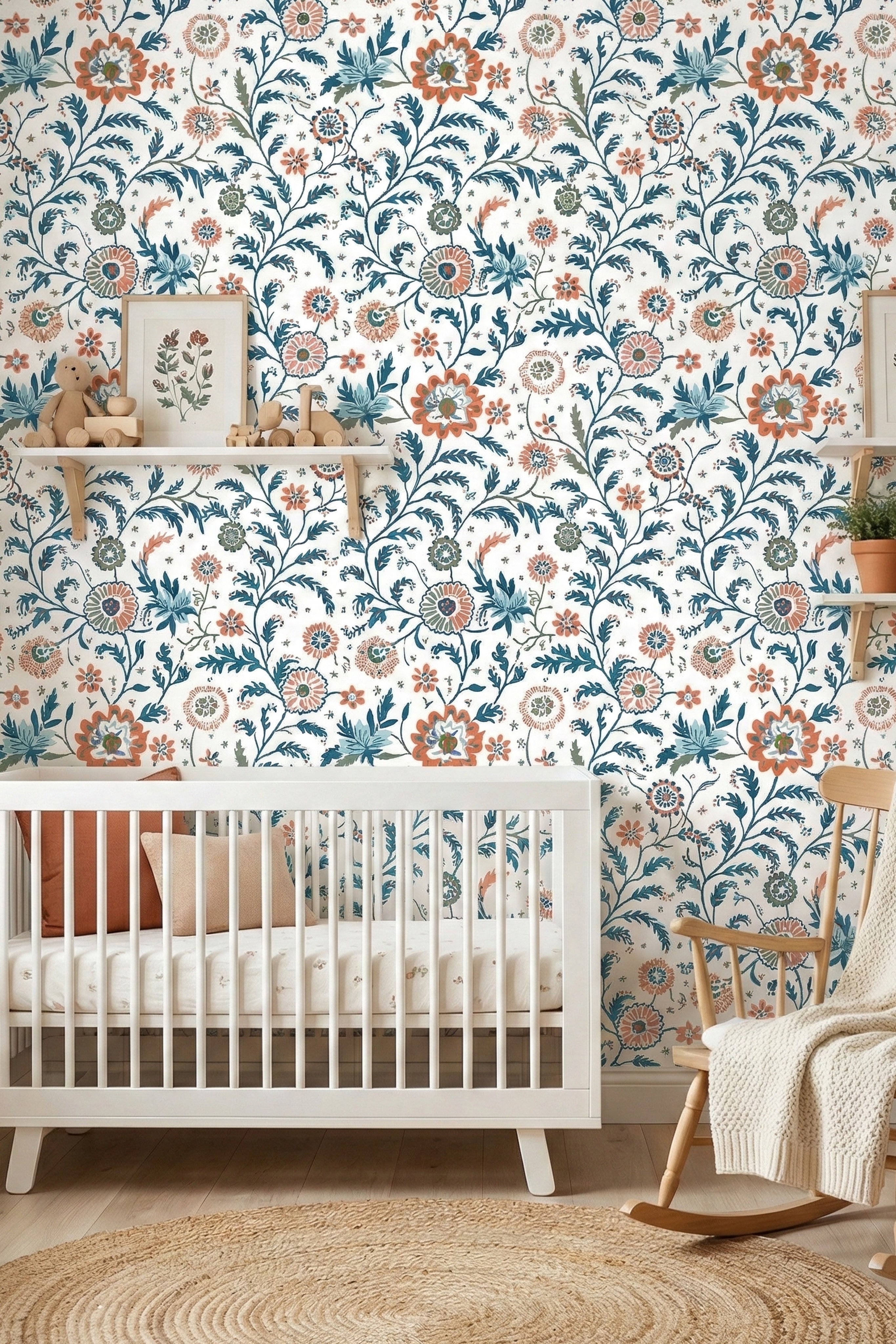 Teal, coral, and sage folk botanicals on white wallpaper in a nursery.