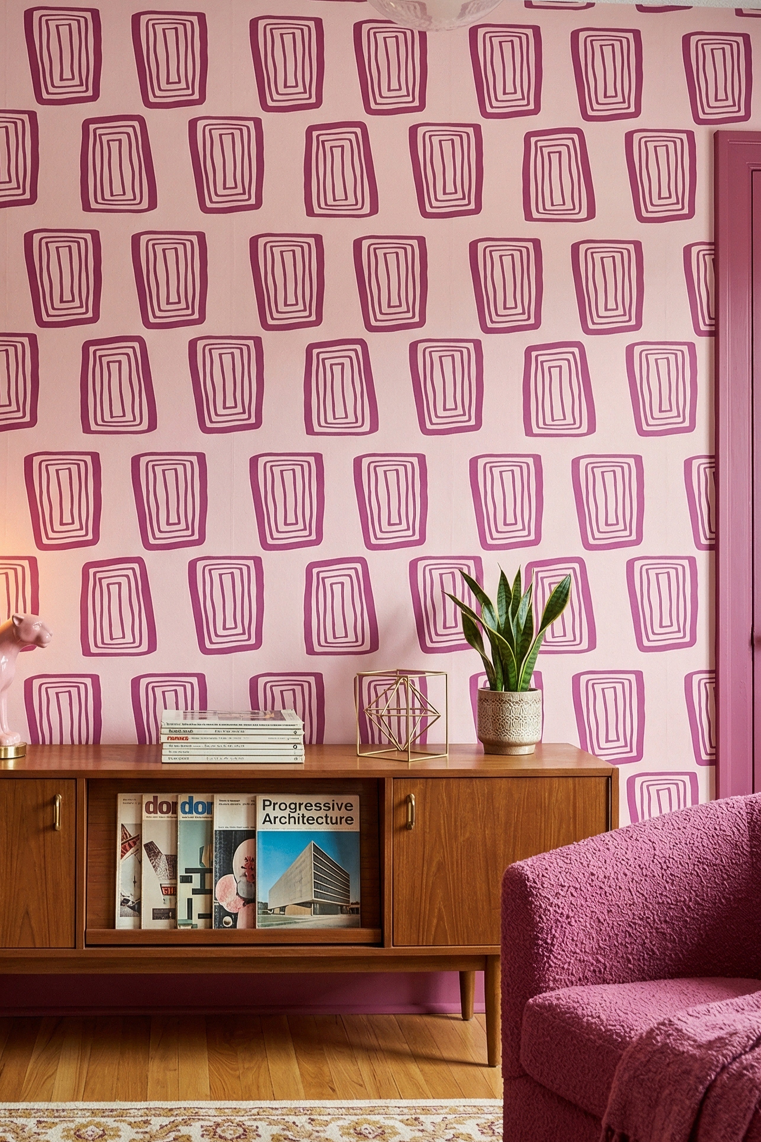 Magenta concentric rectangles on a warm blush wallpaper in a living room.