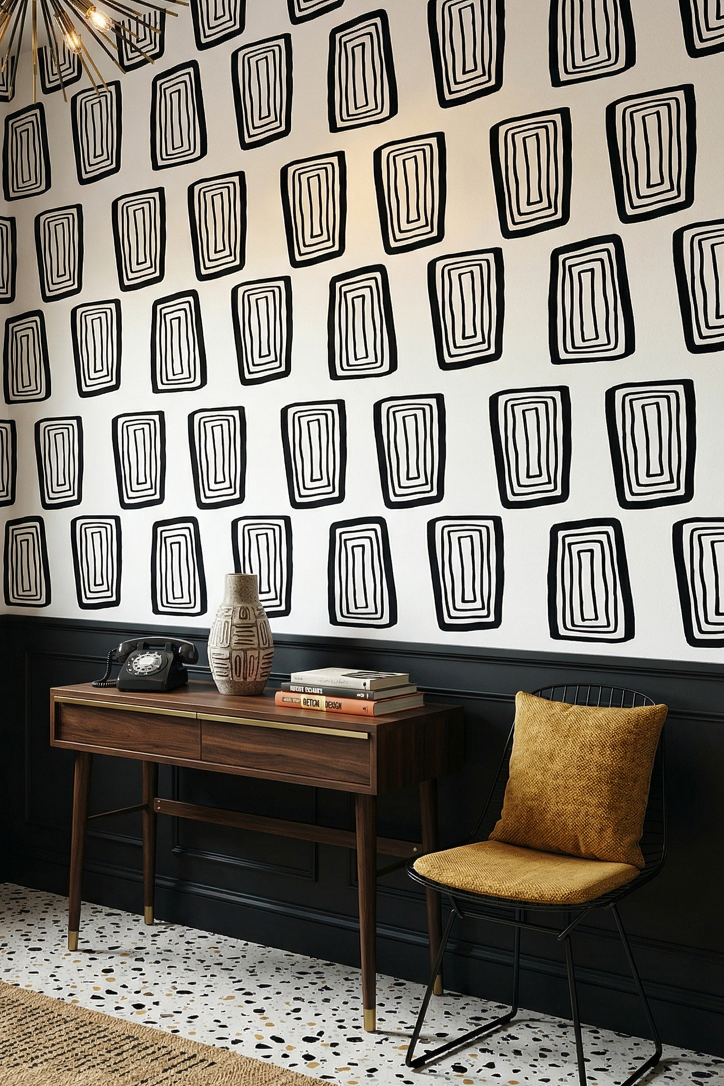 Crisp black concentric rectangles on a white wallpaper in an entryway.