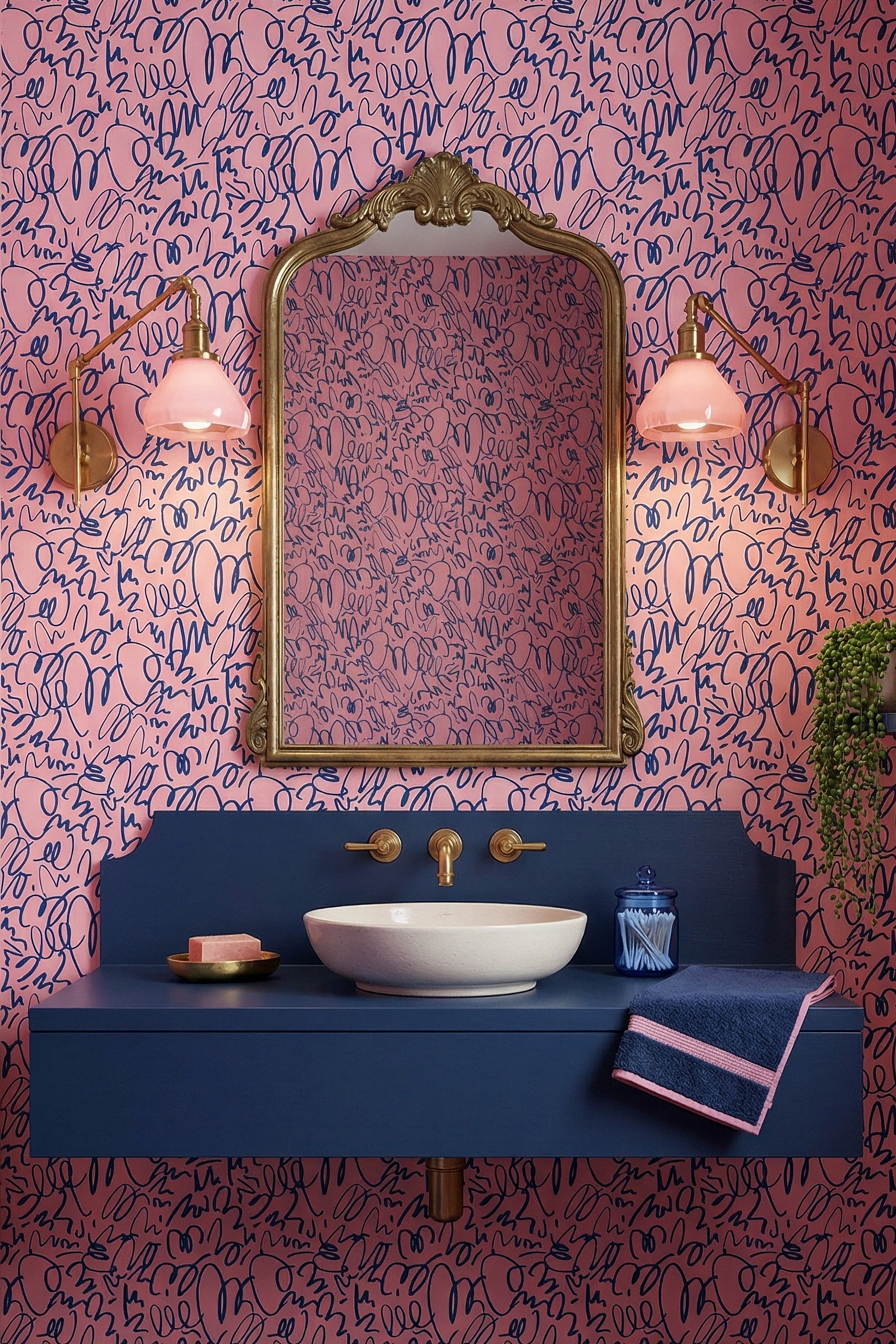Looping navy doodles on a cheerful pink wallpaper in a powder room.