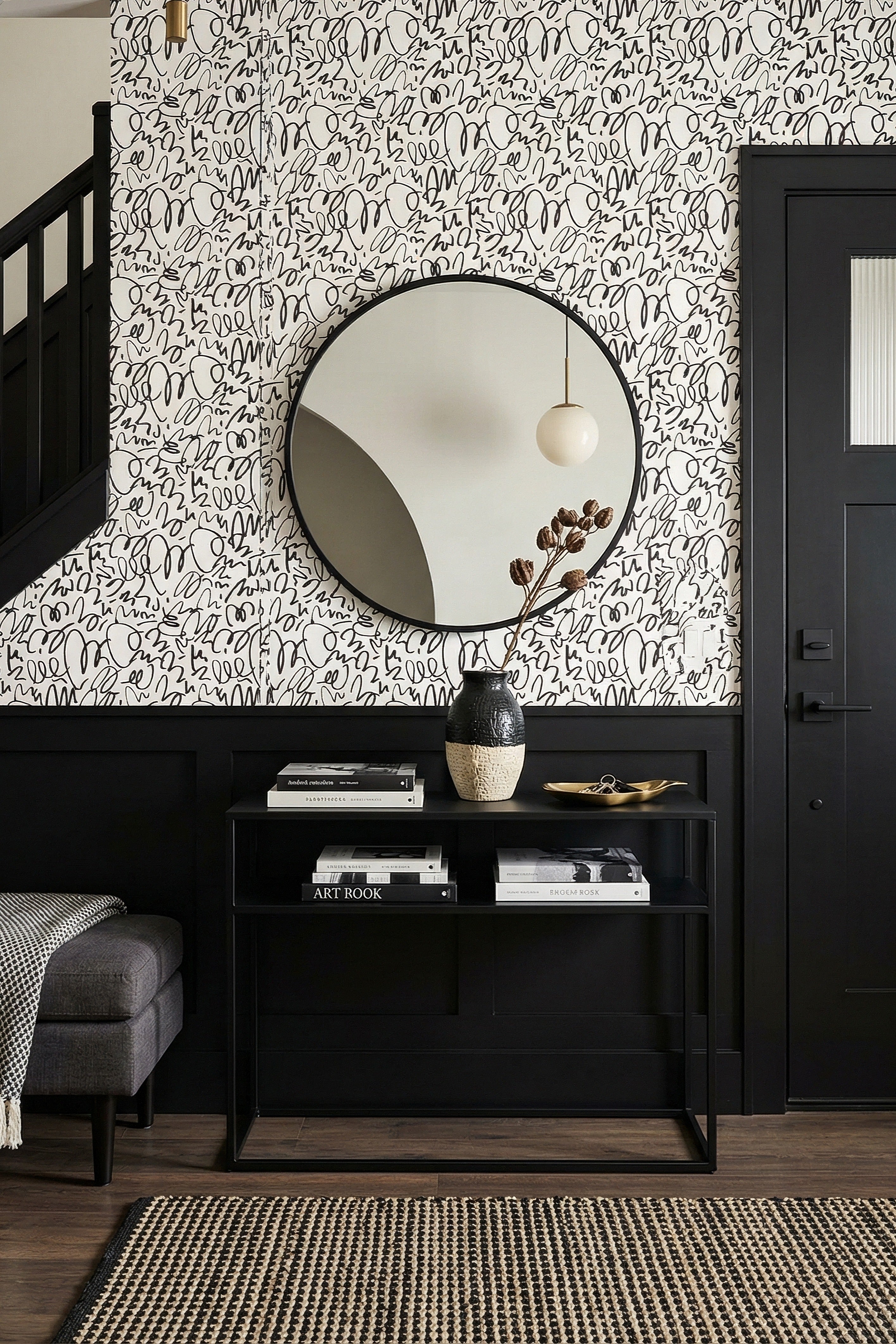 Restless black scribbles on a bright white doodle wallpaper in an entryway.