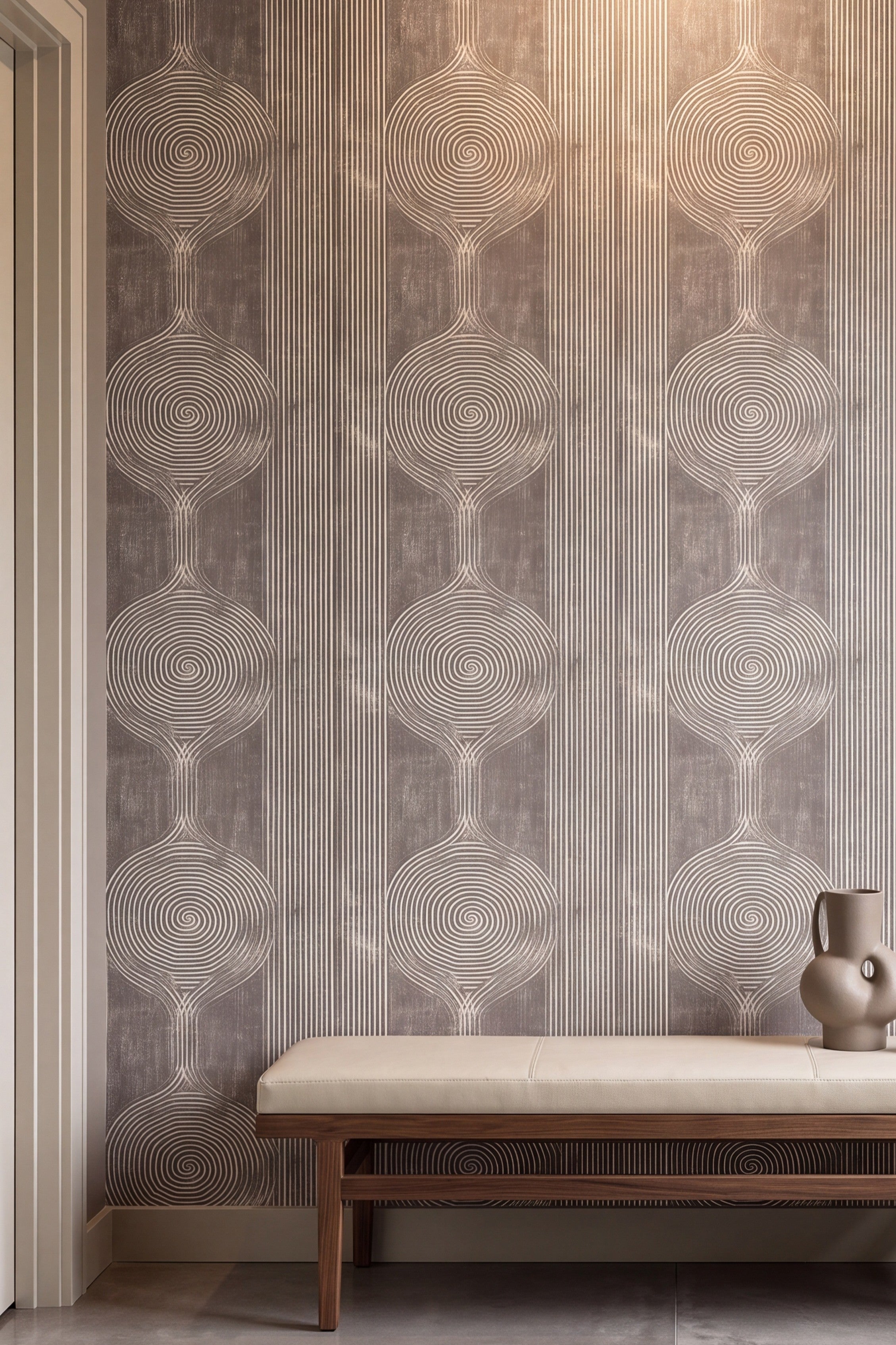Taupe and stone-gray spirals and stripes on a mineral wallpaper on an accent wall.