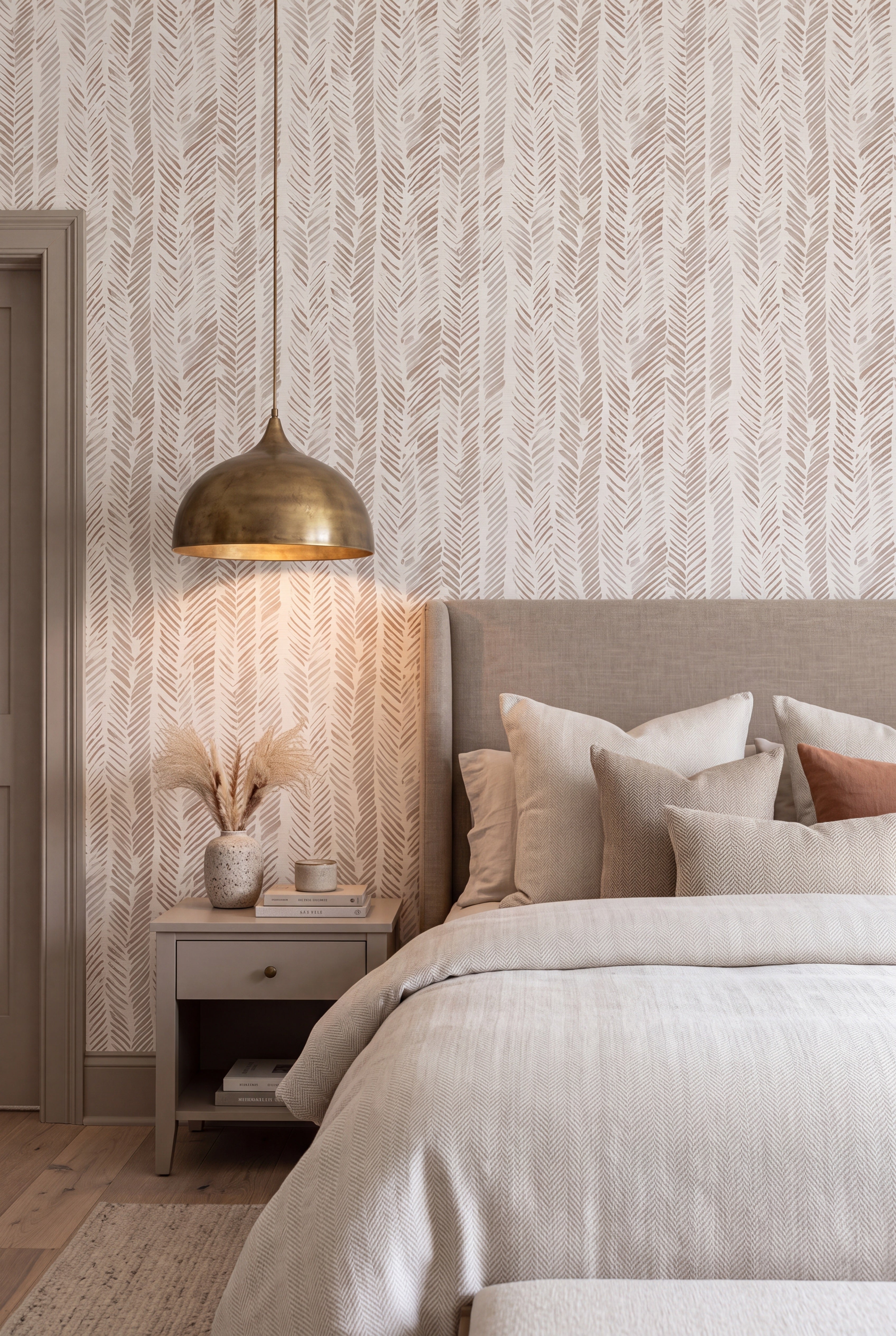 Warm taupe and ivory herringbone wallpaper in a bedroom.