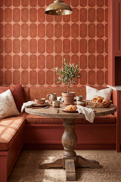 Terracotta scalloped tile wallpaper in a breakfast nook.