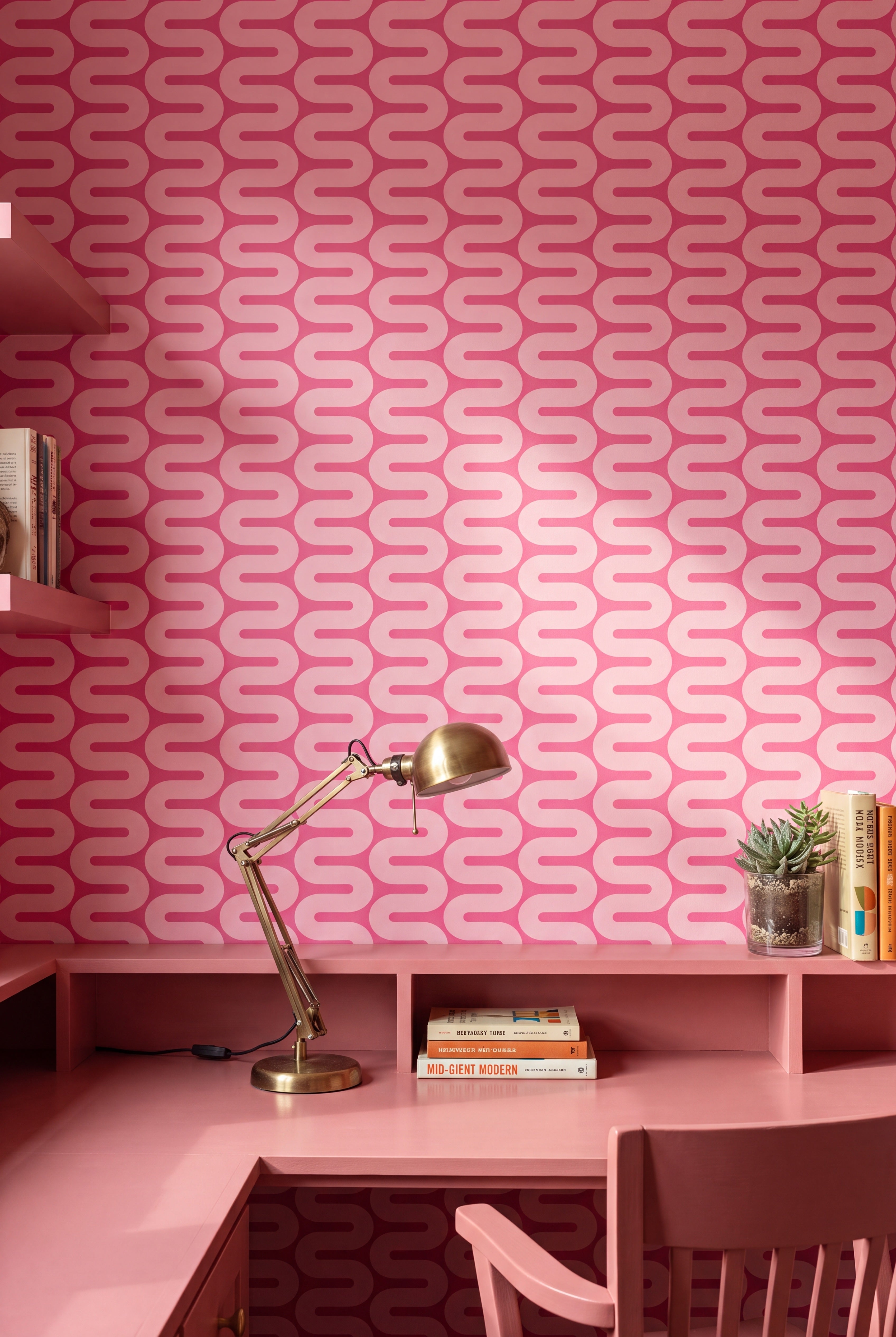Hot pink and light pink wavy retro stripe wallpaper on a home office accent wall.