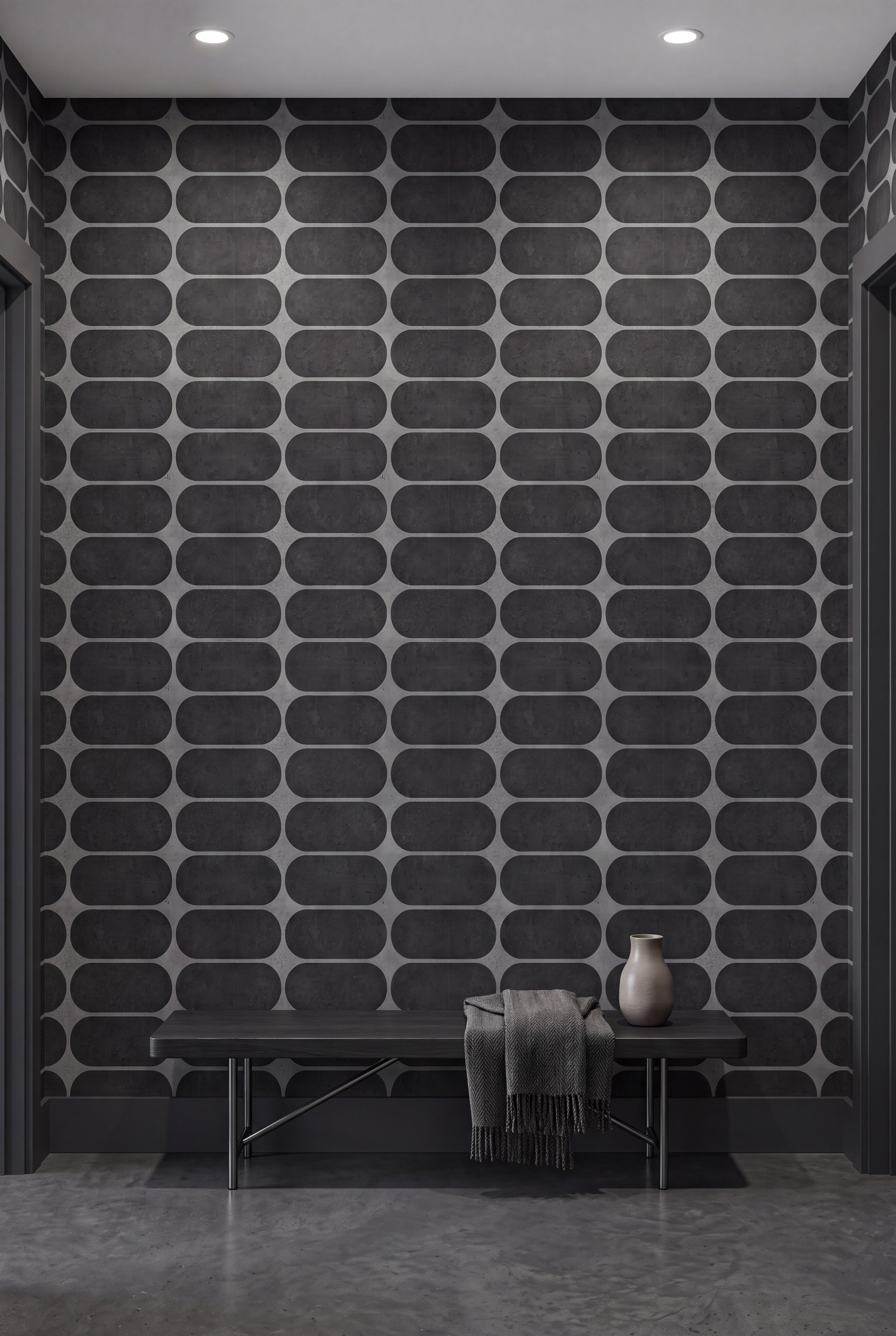 Charcoal blocks and gray arcs in a bold geometric wallpaper on an accent wall.