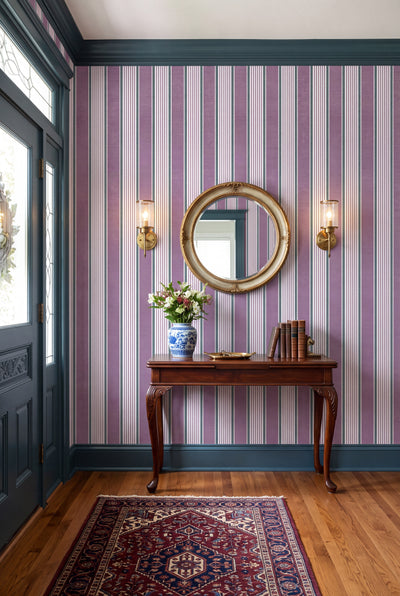 Lavender, cream and sage vertical stripe wallpaper in an entryway.