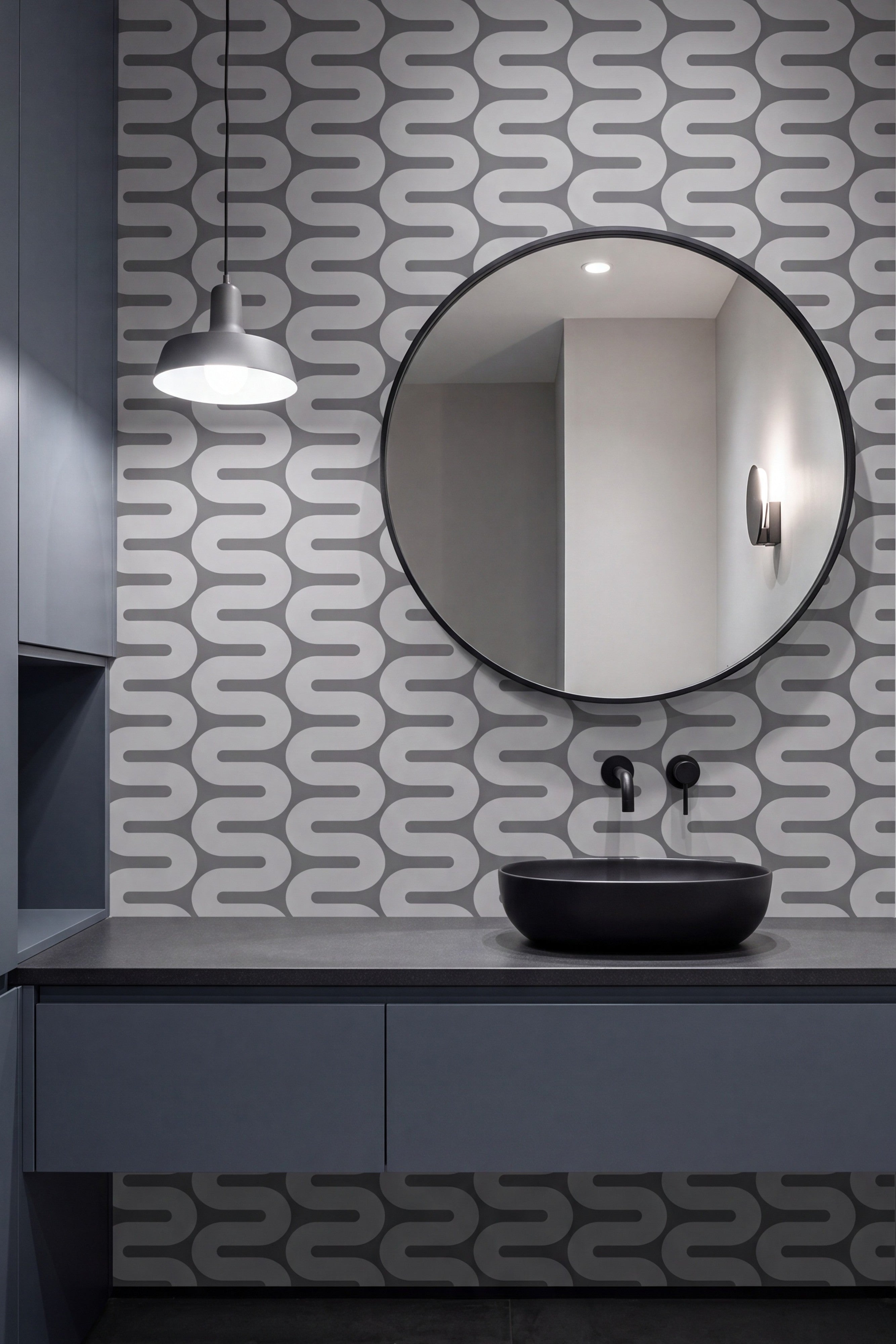 Gray interlocking geometric wallpaper in a powder room.