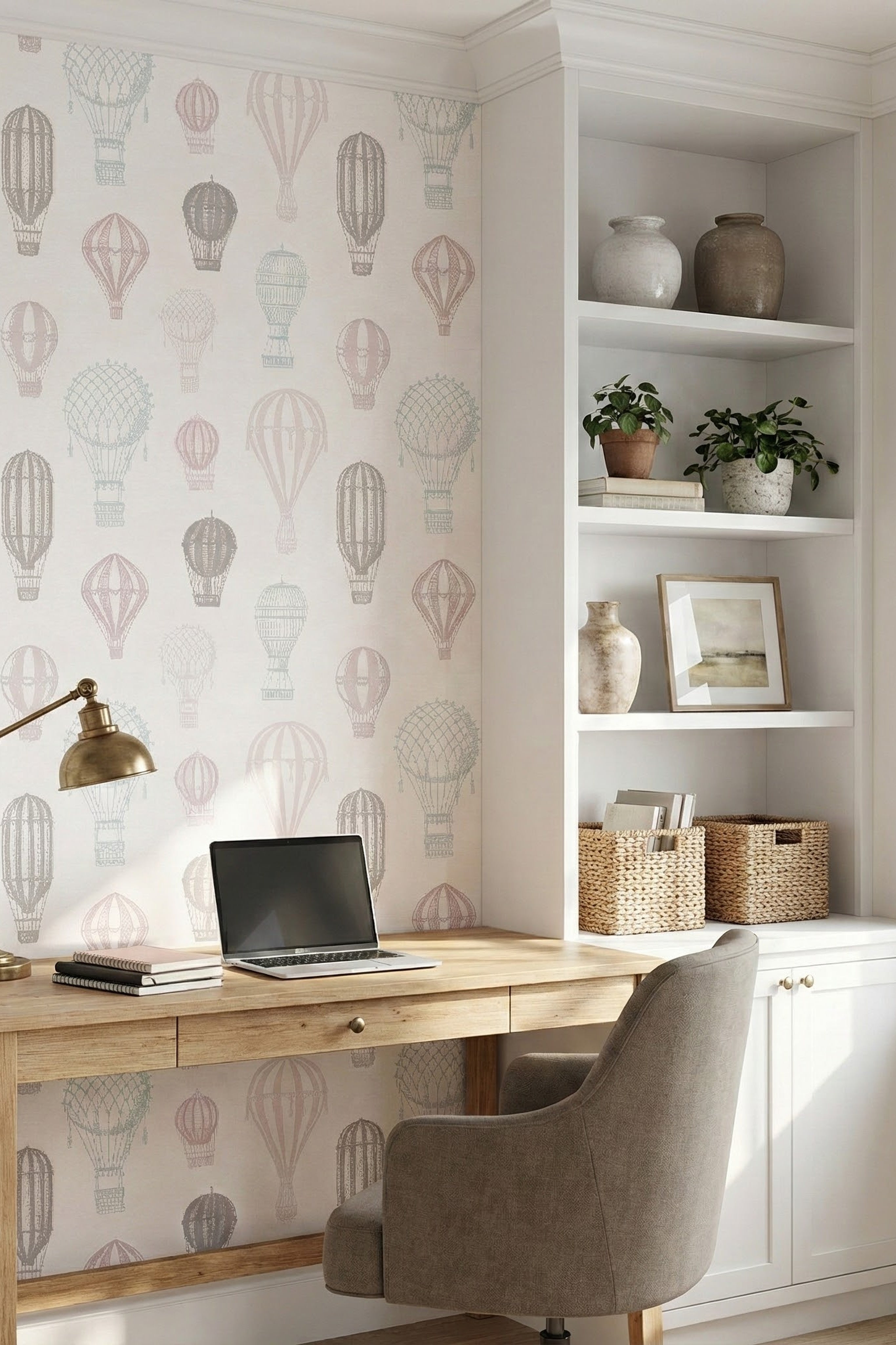 Blush and blue hot air balloons on ivory wallpaper in a home office.