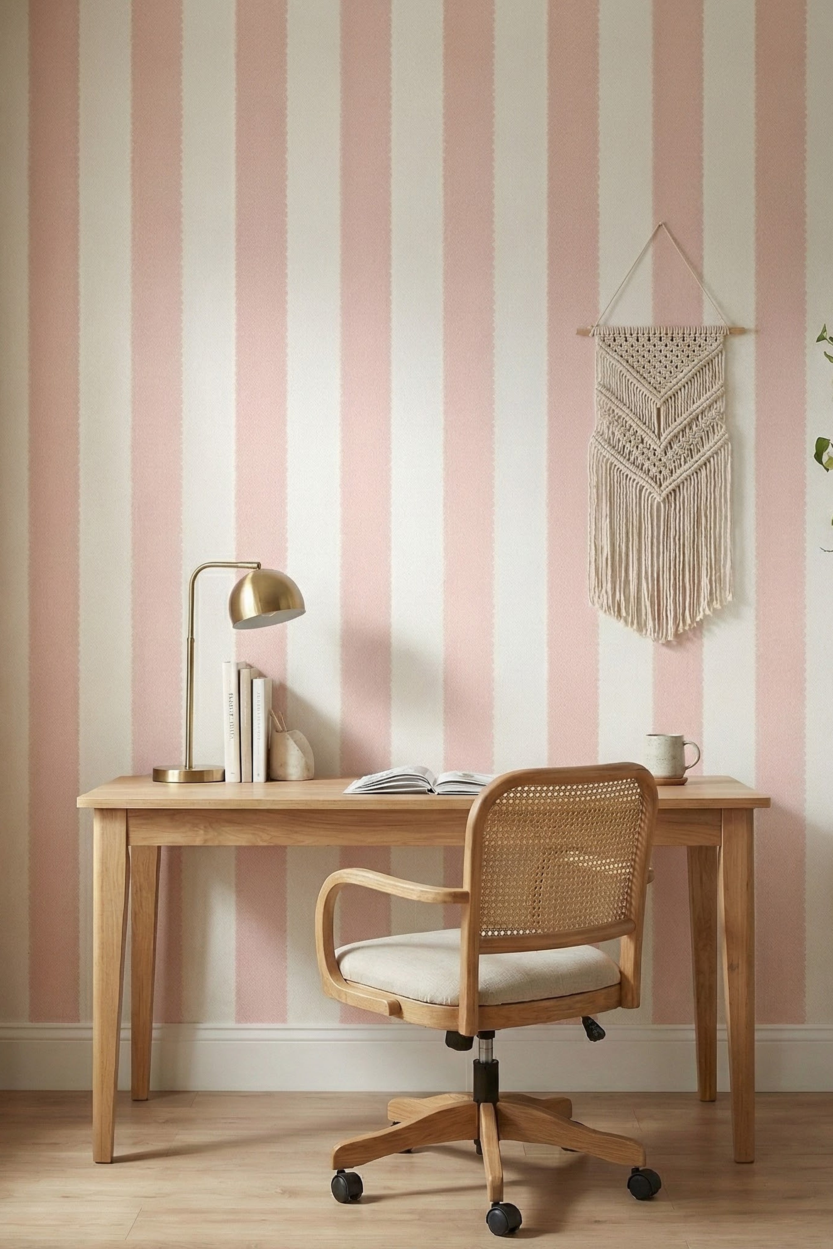Blush-pink scalloped stripes on off-white wallpaper in a home office.