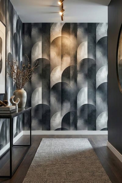 Charcoal and cool grey oversized arches on a mural-like wallpaper in an entryway.