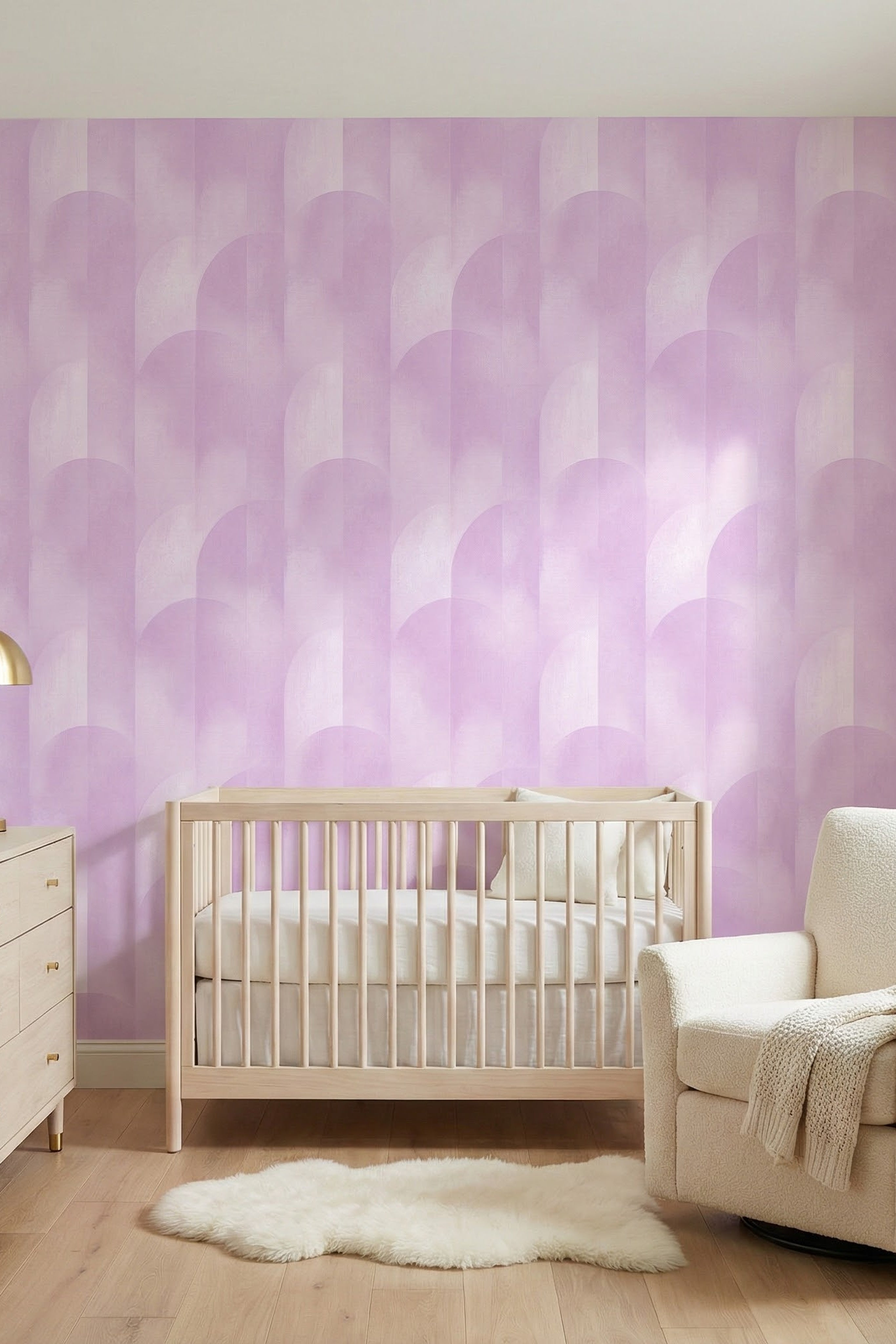 Soft lilac arches on a light geometric wallpaper in a nursery.