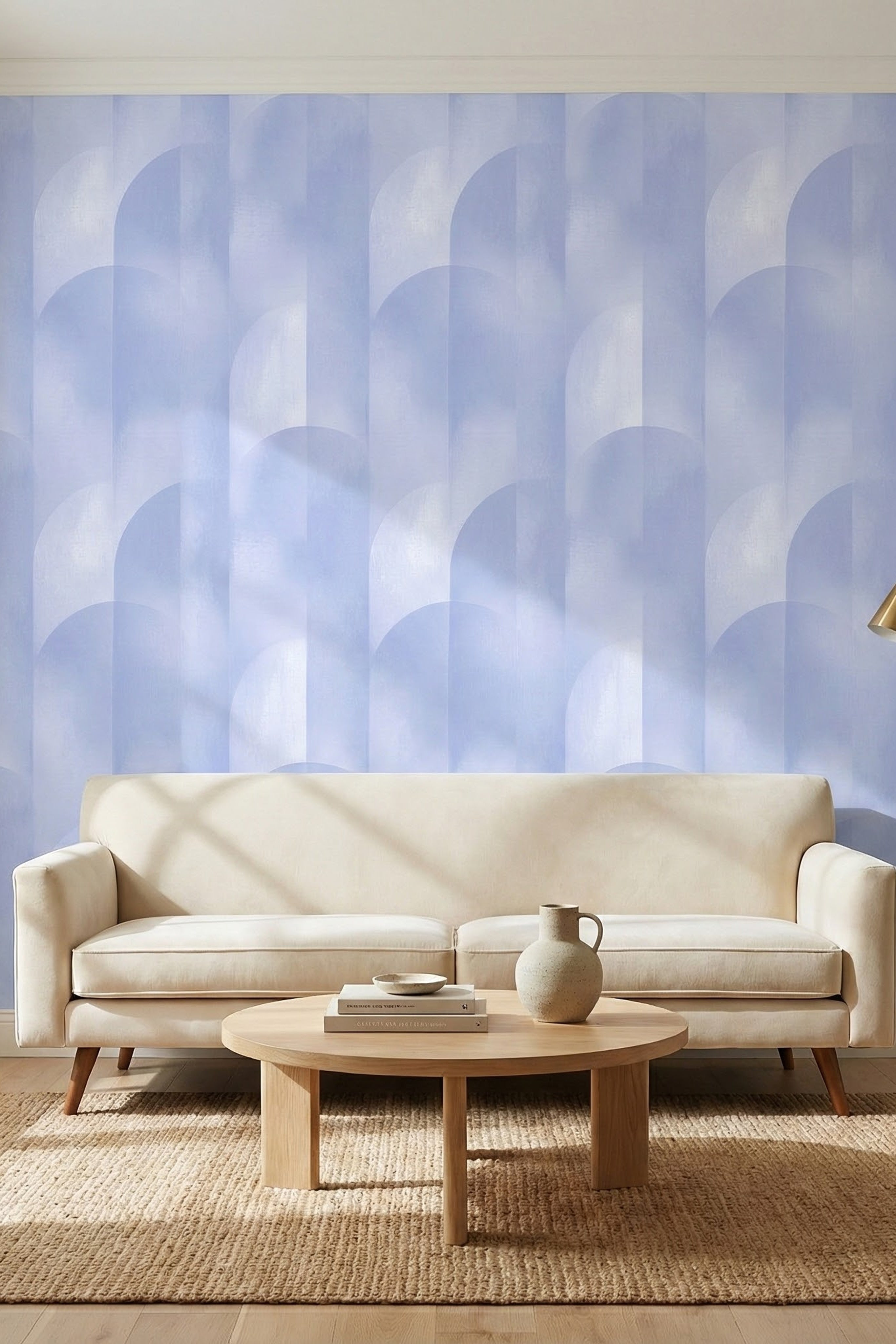 Soft periwinkle blue arches on a pale geometric wallpaper in a living room.