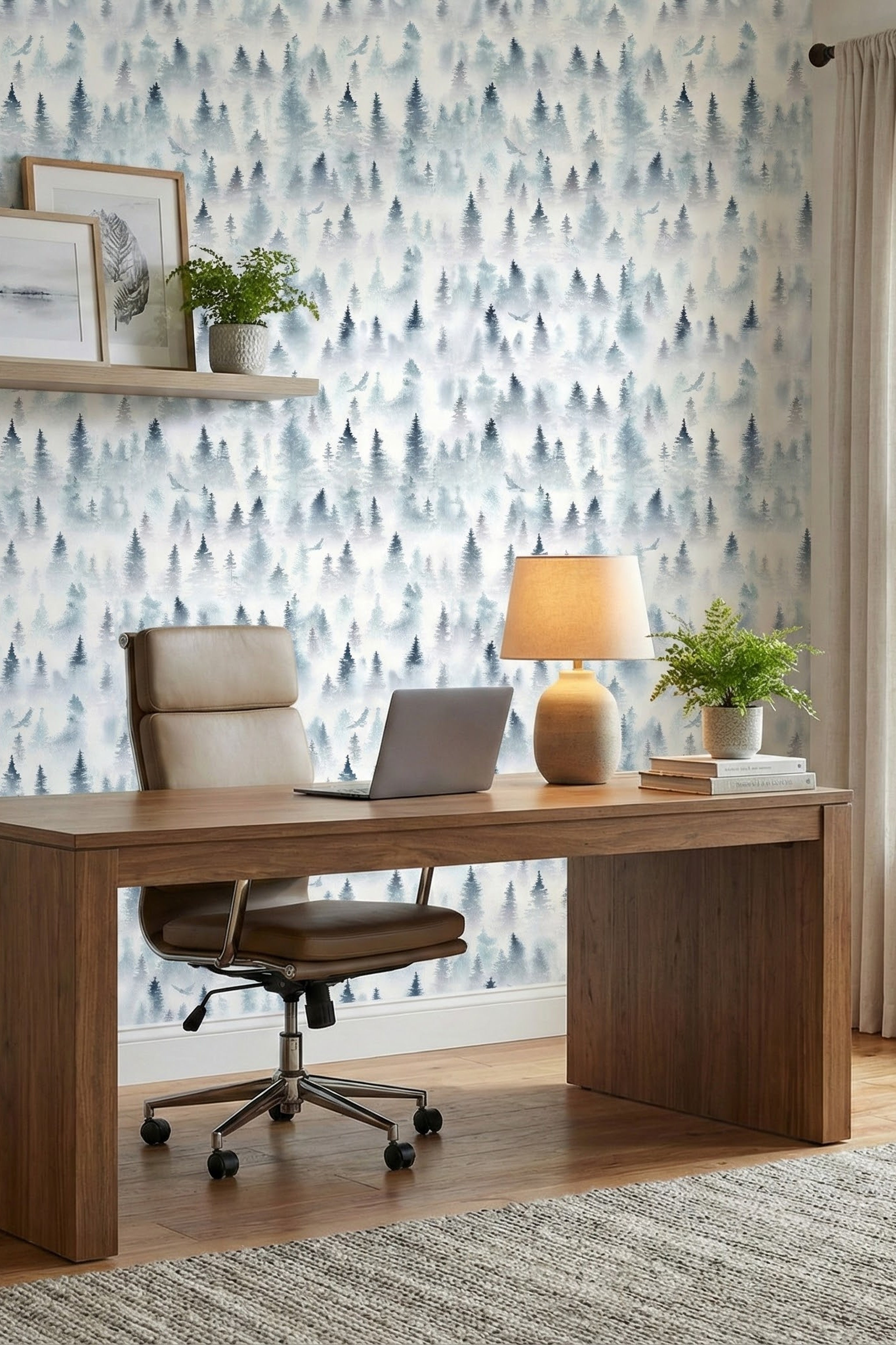 Blue-grey misty evergreens and birds on a watercolor mural wallpaper in a home office.