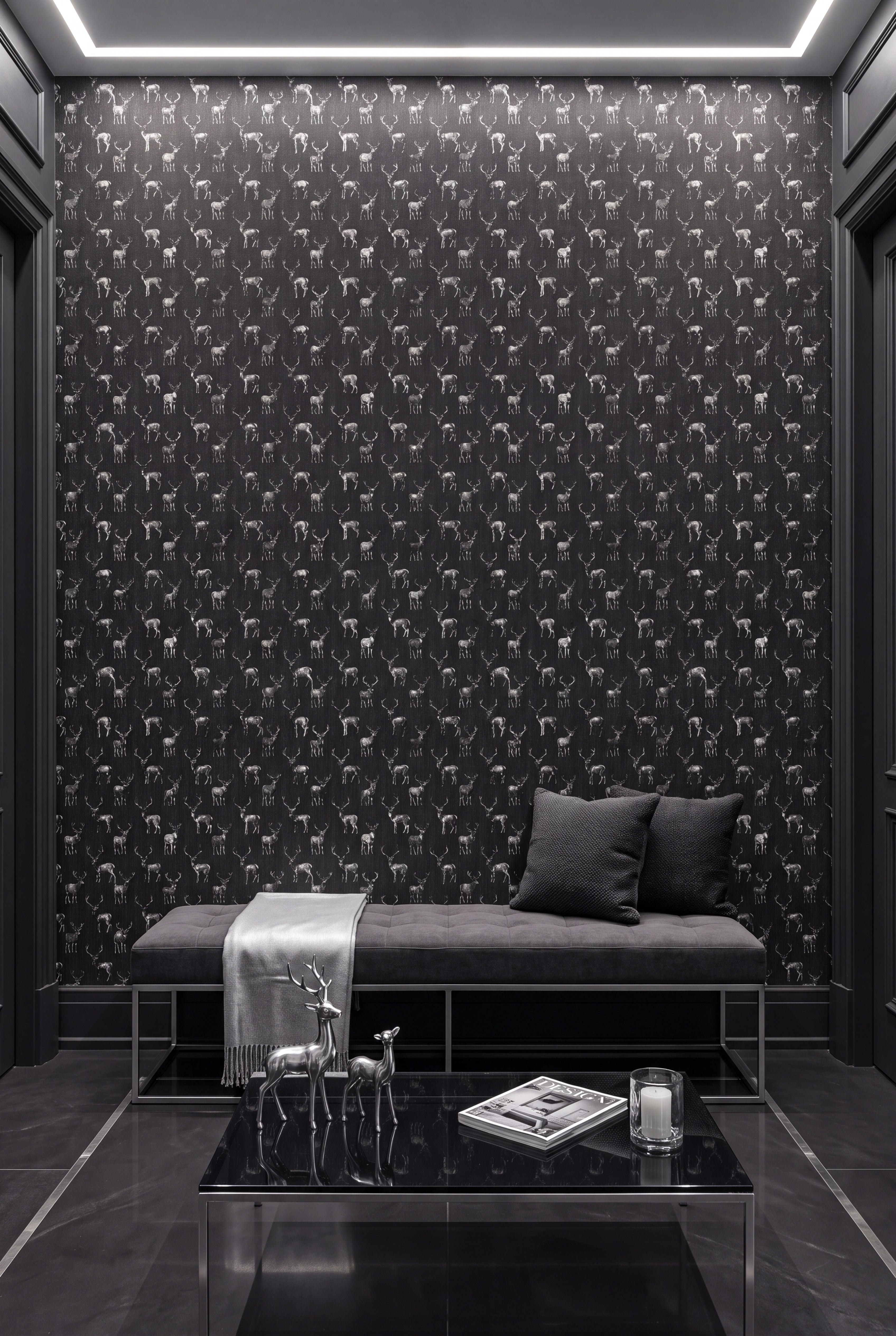 Charcoal sketched stags on a near-black wallpaper on an accent wall.