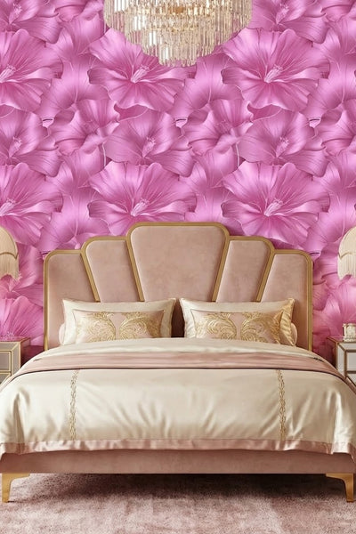 Oversized blush roses on a soft mural-scale floral wallpaper in a bedroom.