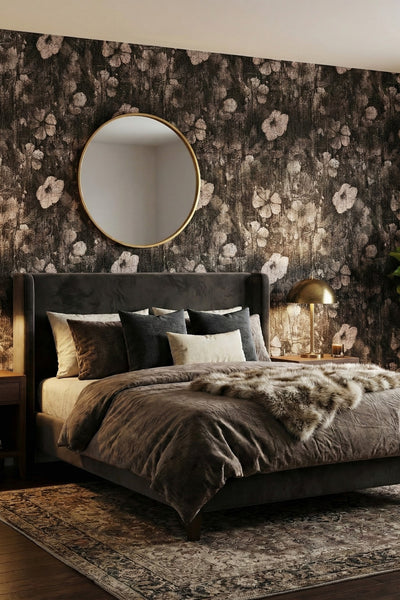 Sepia florals dissolving into charcoal wallpaper in a bedroom.