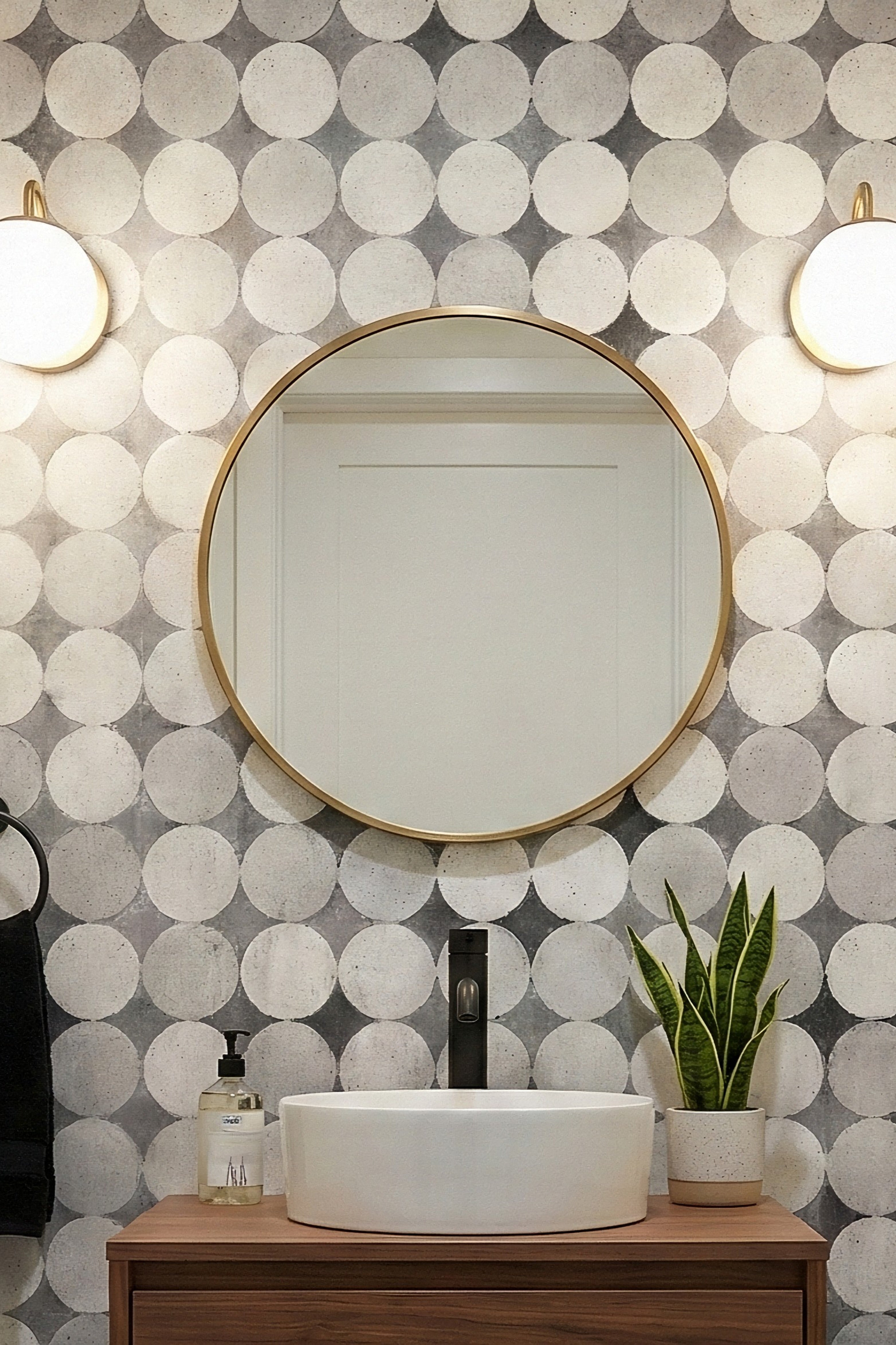 Overlapping black-and-white circles with grey diamonds on powder room wallpaper.