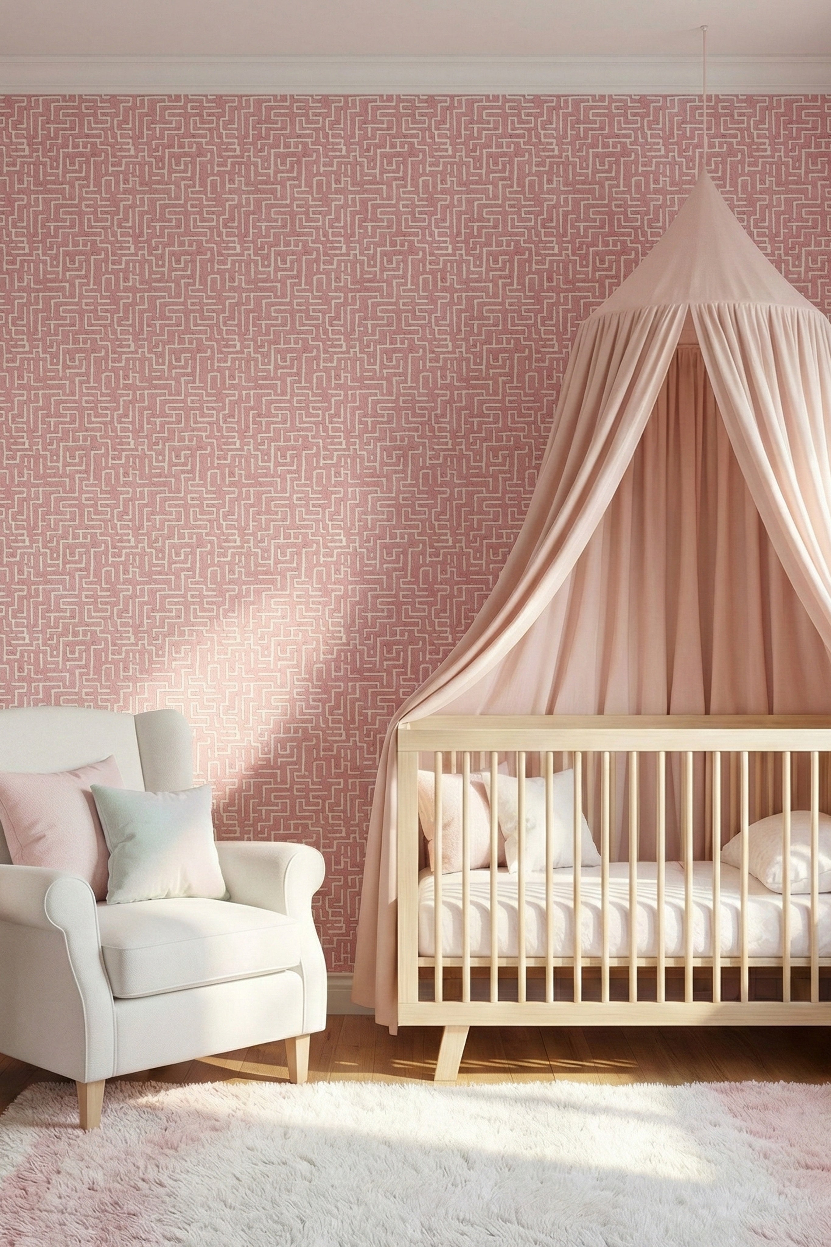 Tiny hamsters in a blush pink and white maze wallpaper in a nursery.