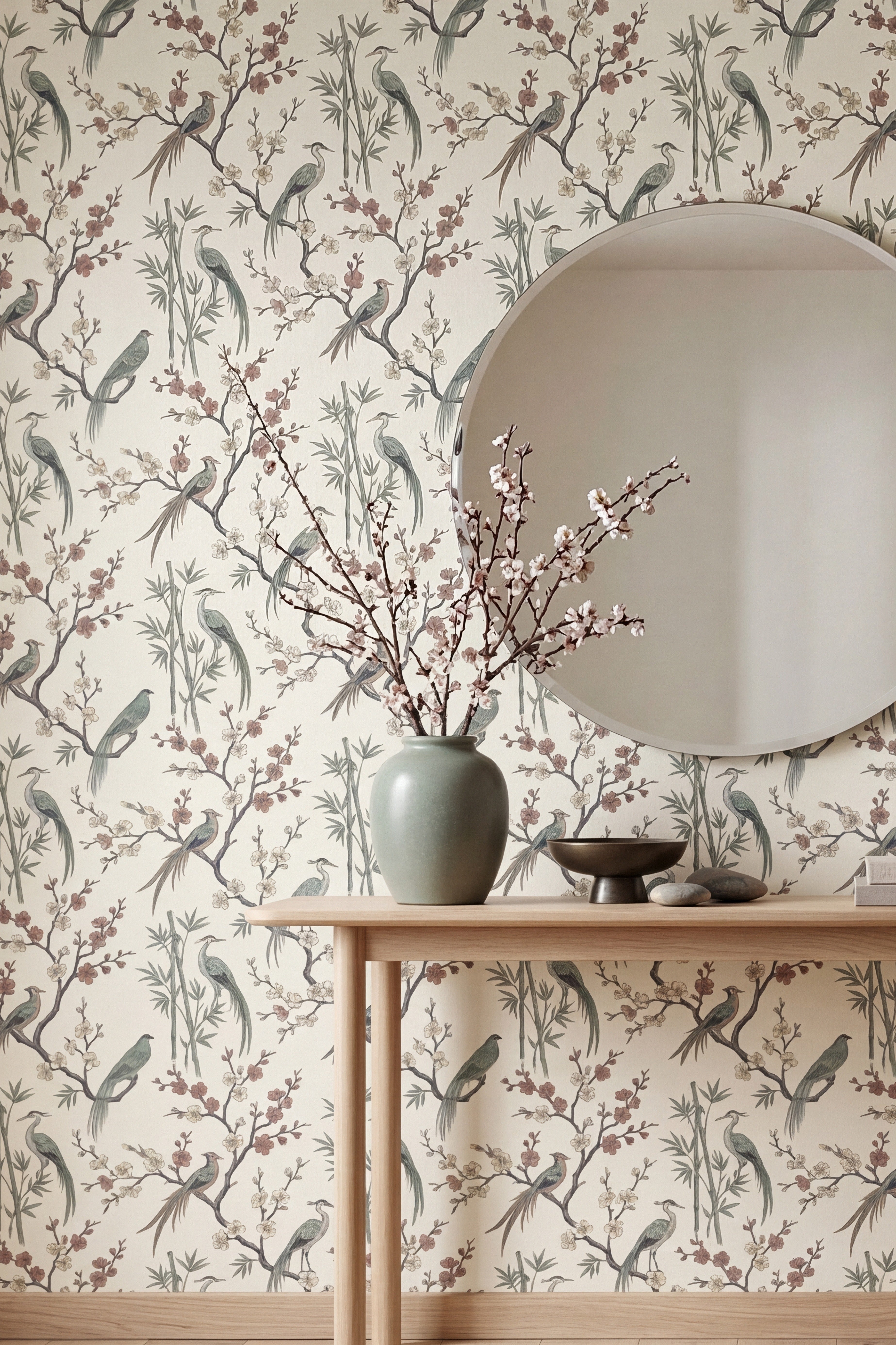Cranes among bamboo and blossoms on airy light wallpaper in an entryway.